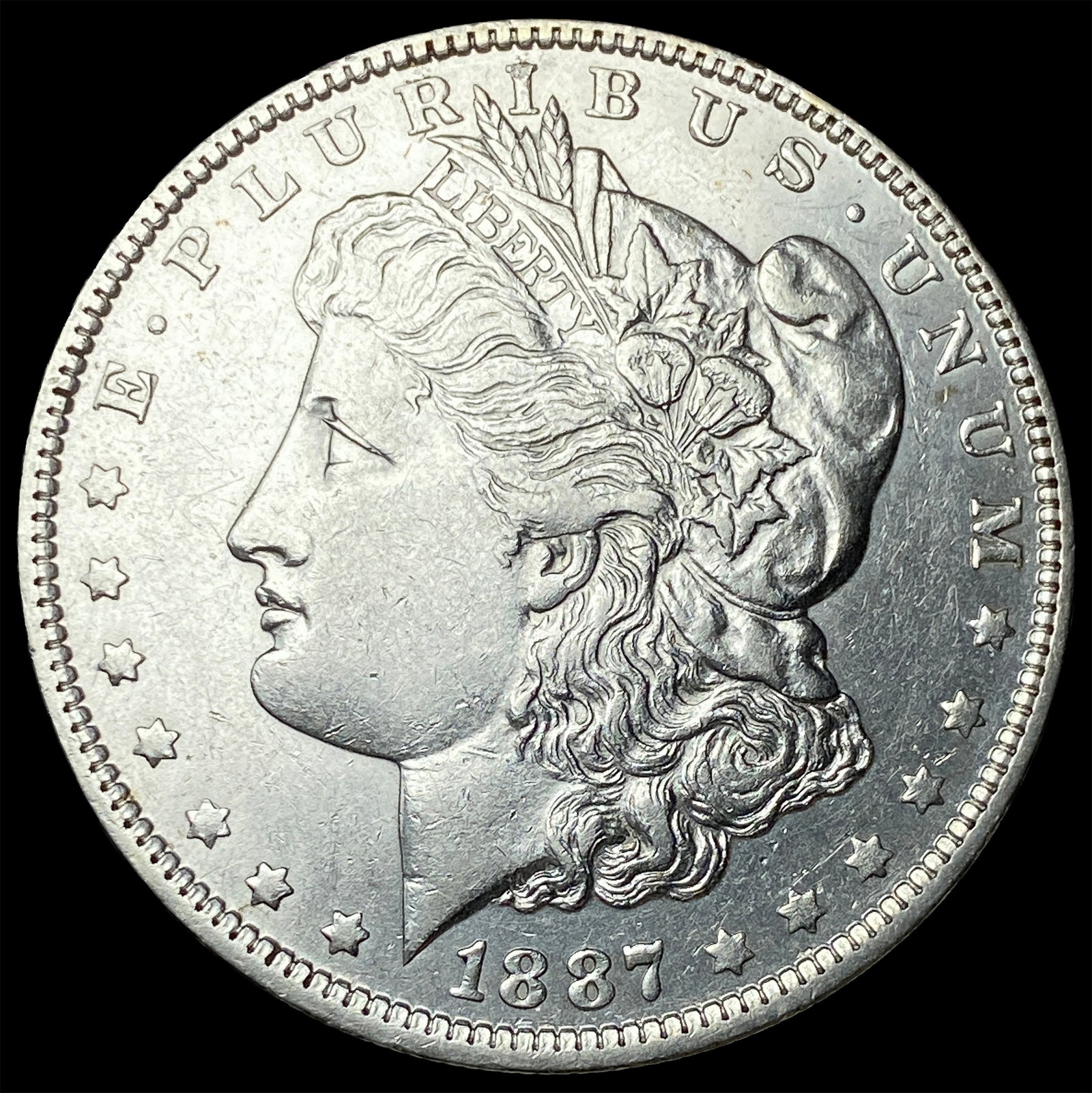 1887-O Silver Morgan Dollar CLOSELY UNCIRCULATED (1 of 2)