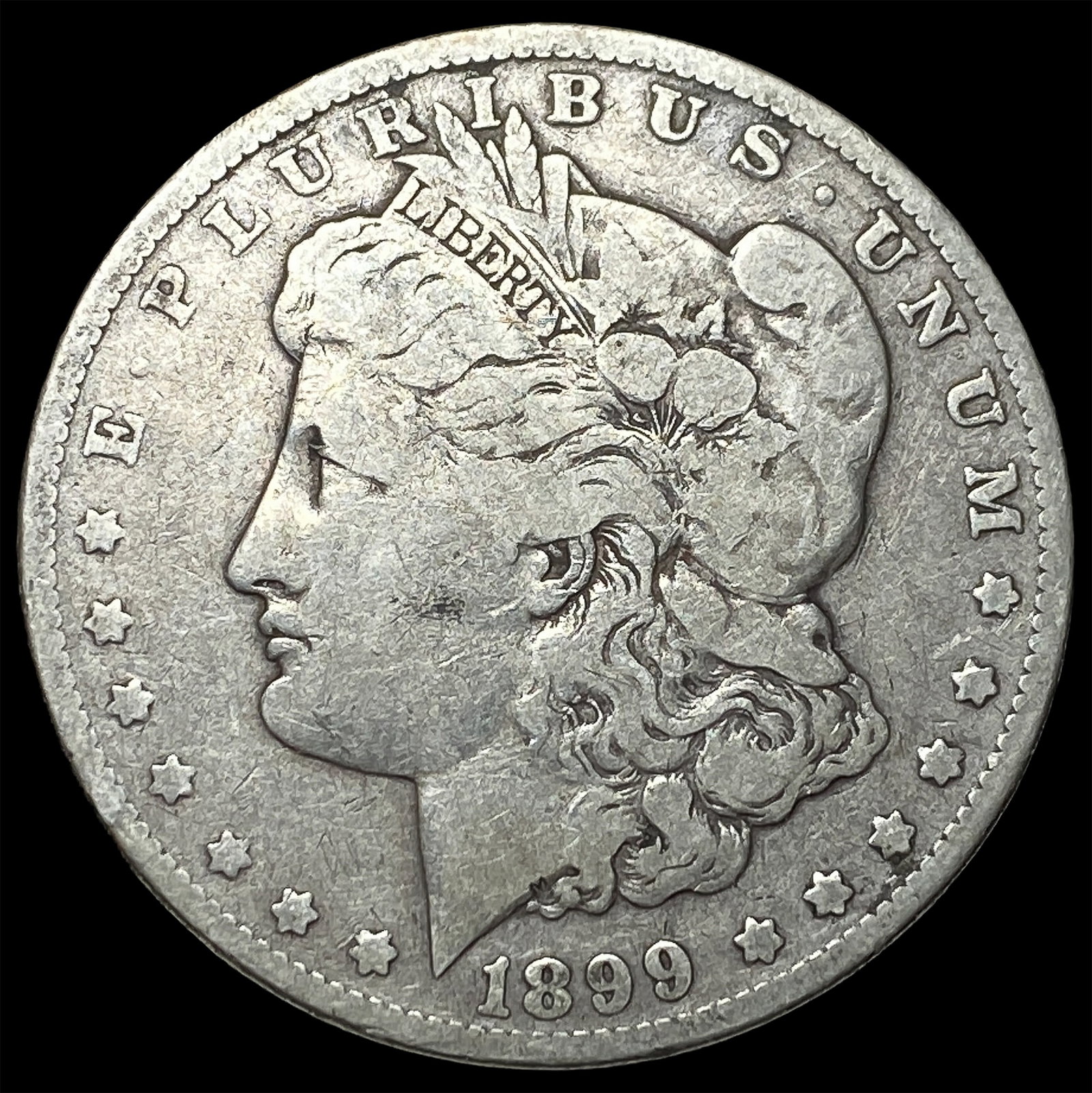 1899 Silver Morgan Dollar ABOUT UNCIRCULATED: 1899 Silver Morgan Dollar ABOUT UNCIRCULATED