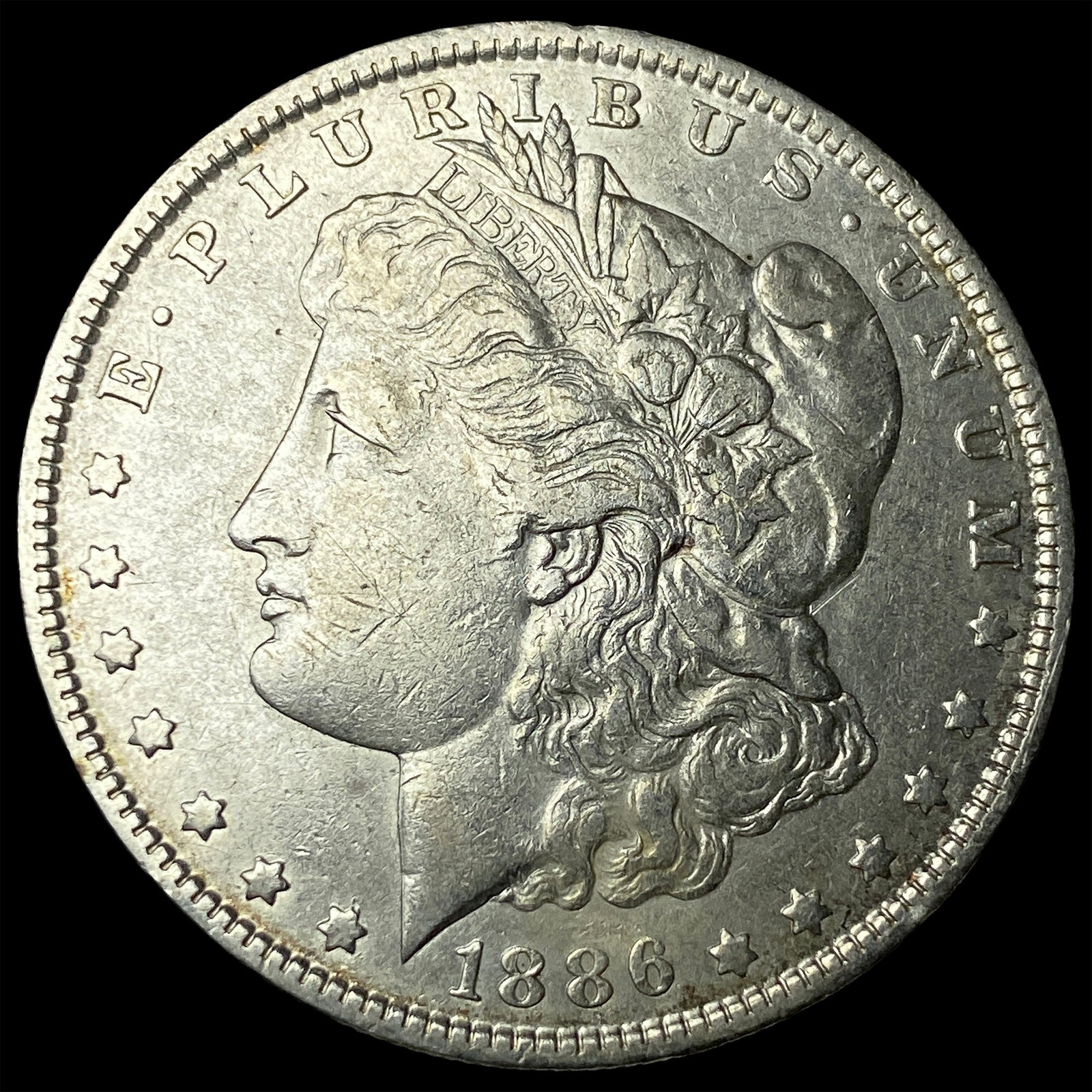 1886-O Silver Morgan Dollar CLOSELY UNCIRCULATED (1 of 2)