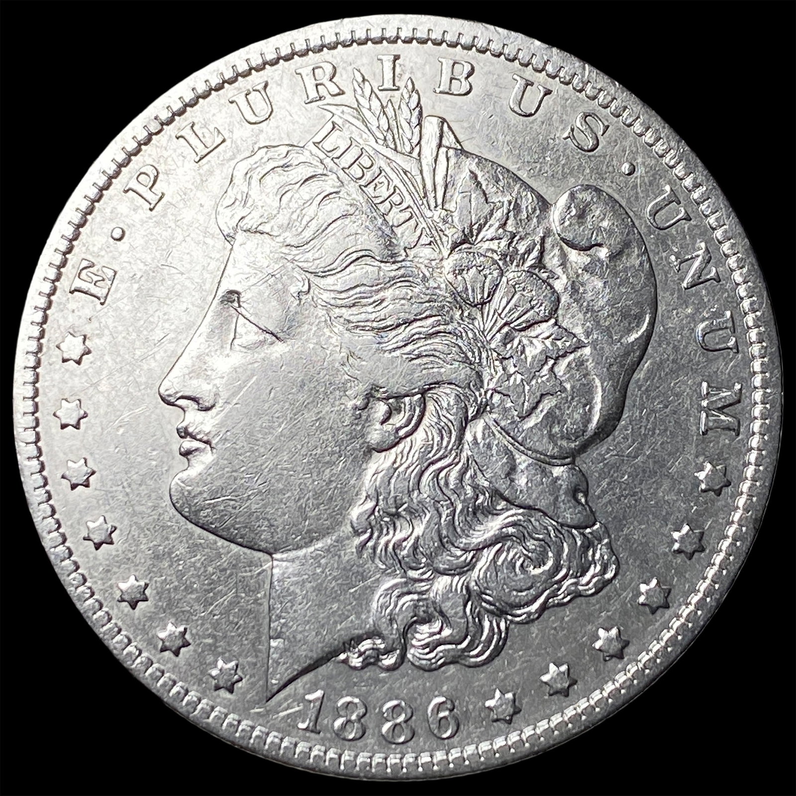 1886-O Silver Morgan Dollar NEARLY UNCIRCULATED (1 of 2)