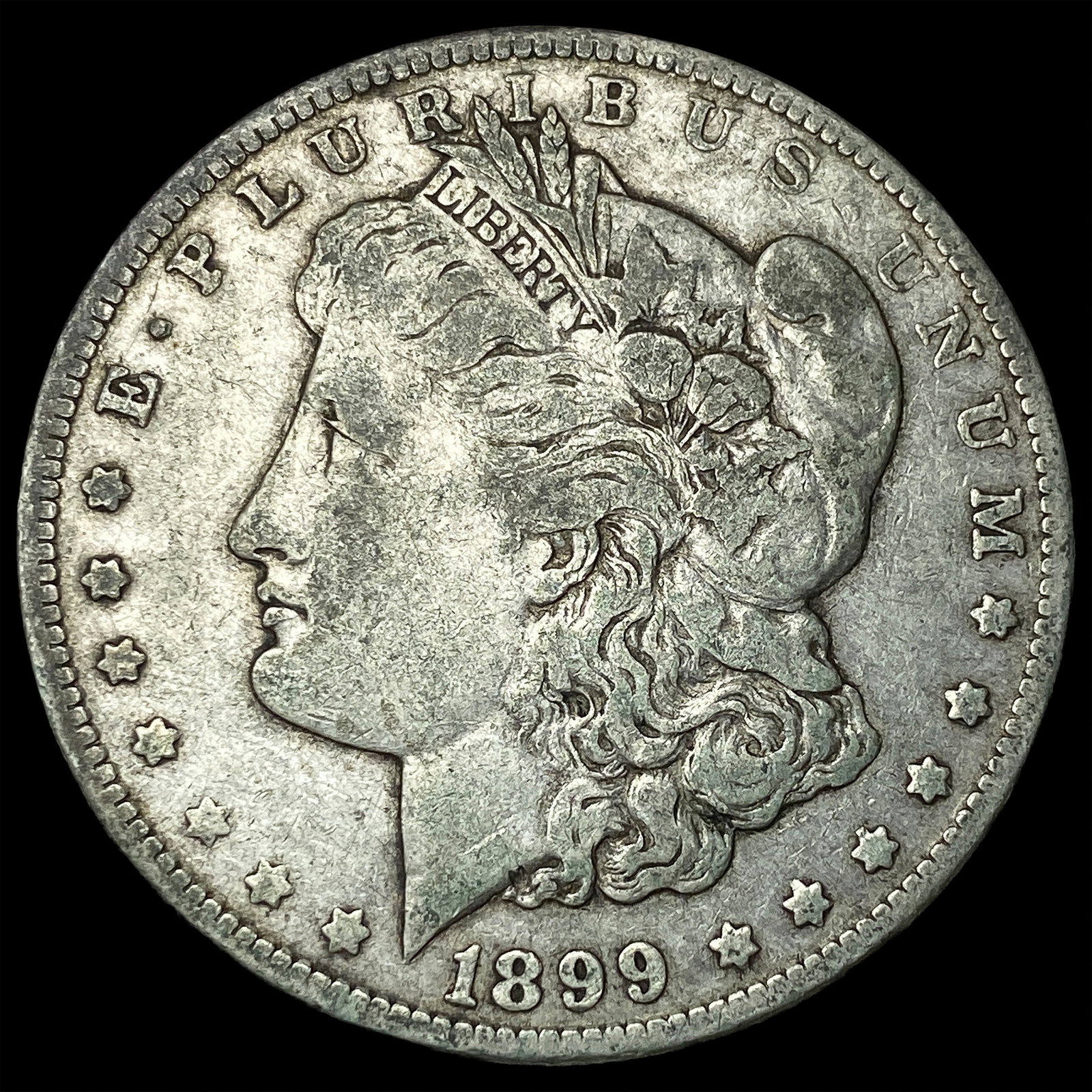 1899-O Micro O Silver Morgan Dollar ABOUT UNCIRCULATED: 1899-O Micro O Silver Morgan Dollar ABOUT UNCIRCULATED