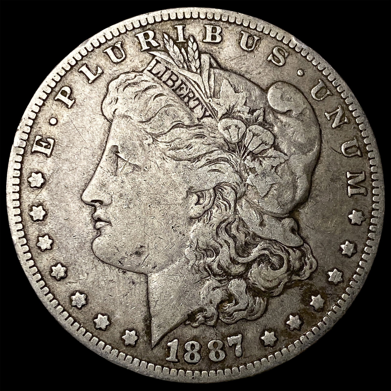 1887-O Silver Morgan Dollar ABOUT UNCIRCULATED: 1887-O Silver Morgan Dollar ABOUT UNCIRCULATED