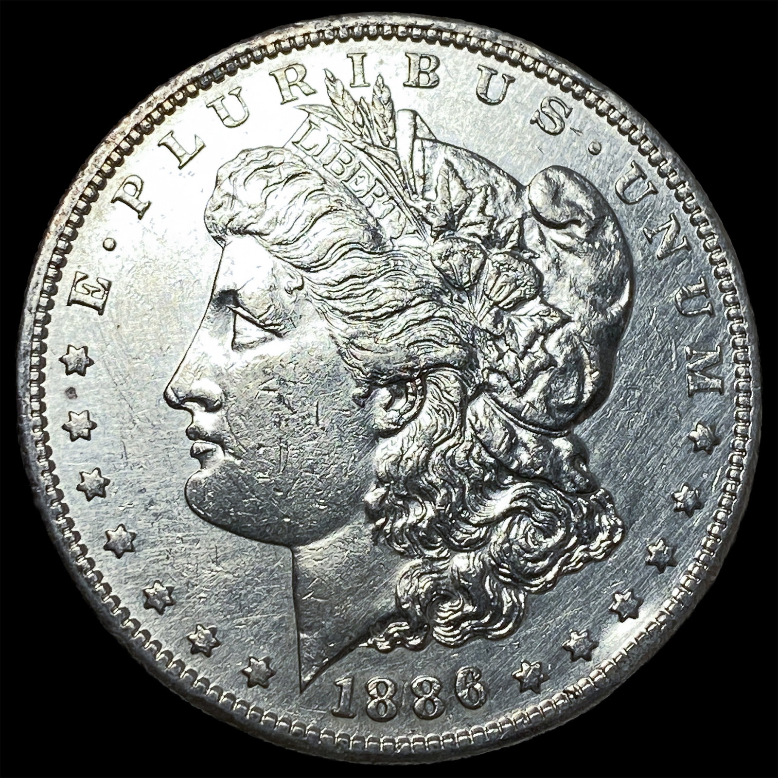 1886 Morgan Silver Dollar CLOSELY UNCIRCULATED (1 of 2)
