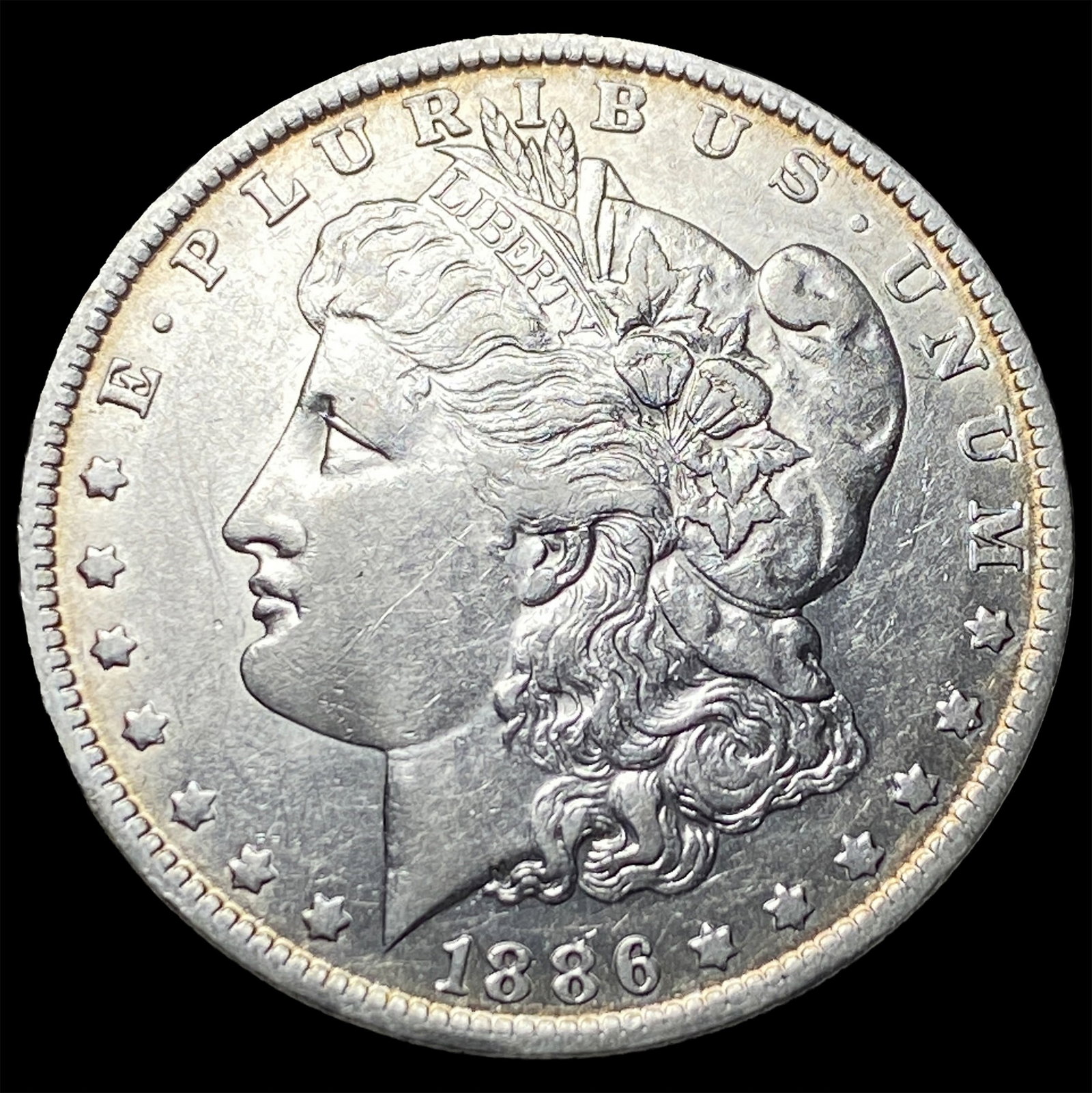 1886-O Silver Morgan Dollar CLOSELY UNCIRCULATED (1 of 2)