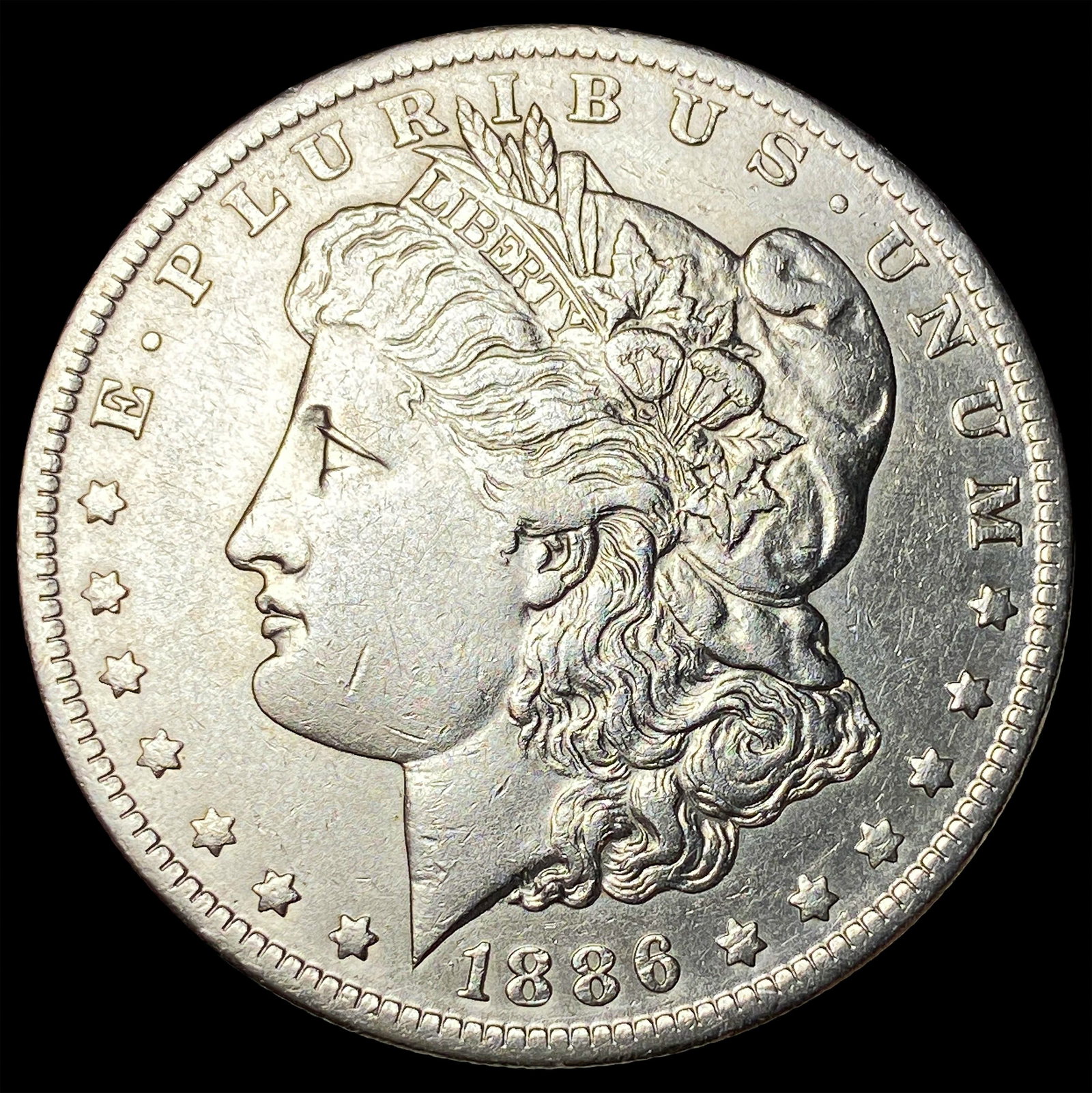1886-O Silver Morgan Dollar CLOSELY UNCIRCULATED (1 of 2)