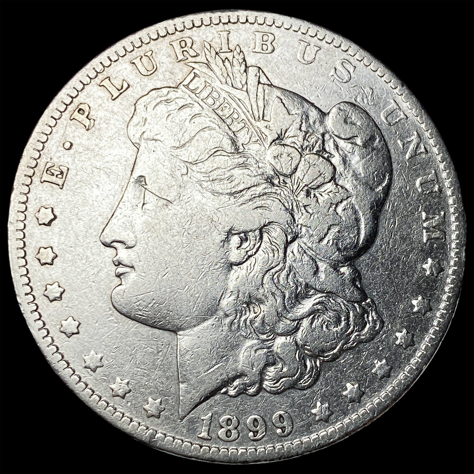 1899-O Micro O Silver Morgan Dollar ABOUT UNCIRCULATED: 1899-O Micro O Silver Morgan Dollar ABOUT UNCIRCULATED