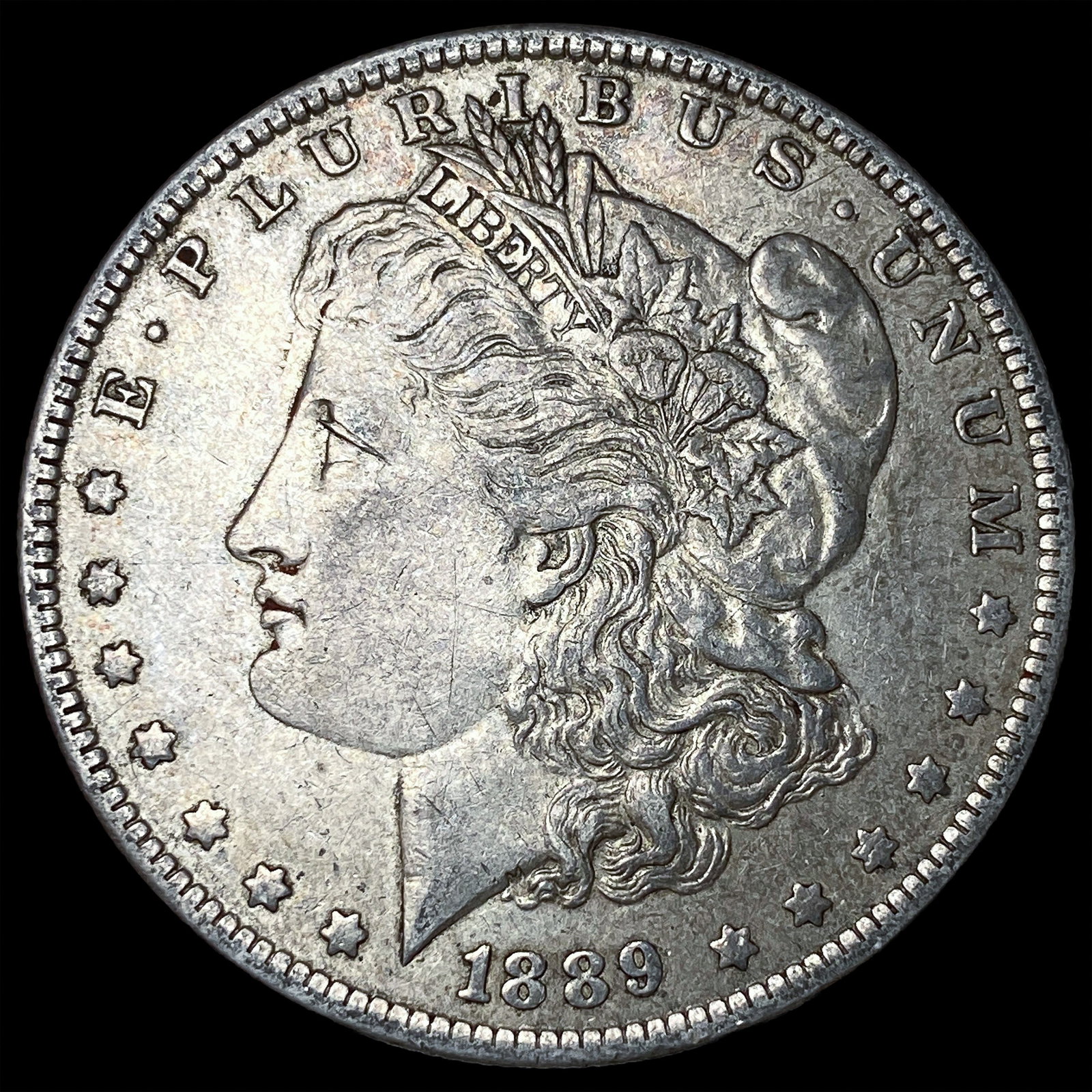 1889-O Silver Morgan Dollar NEARLY UNCIRCULATED (1 of 2)