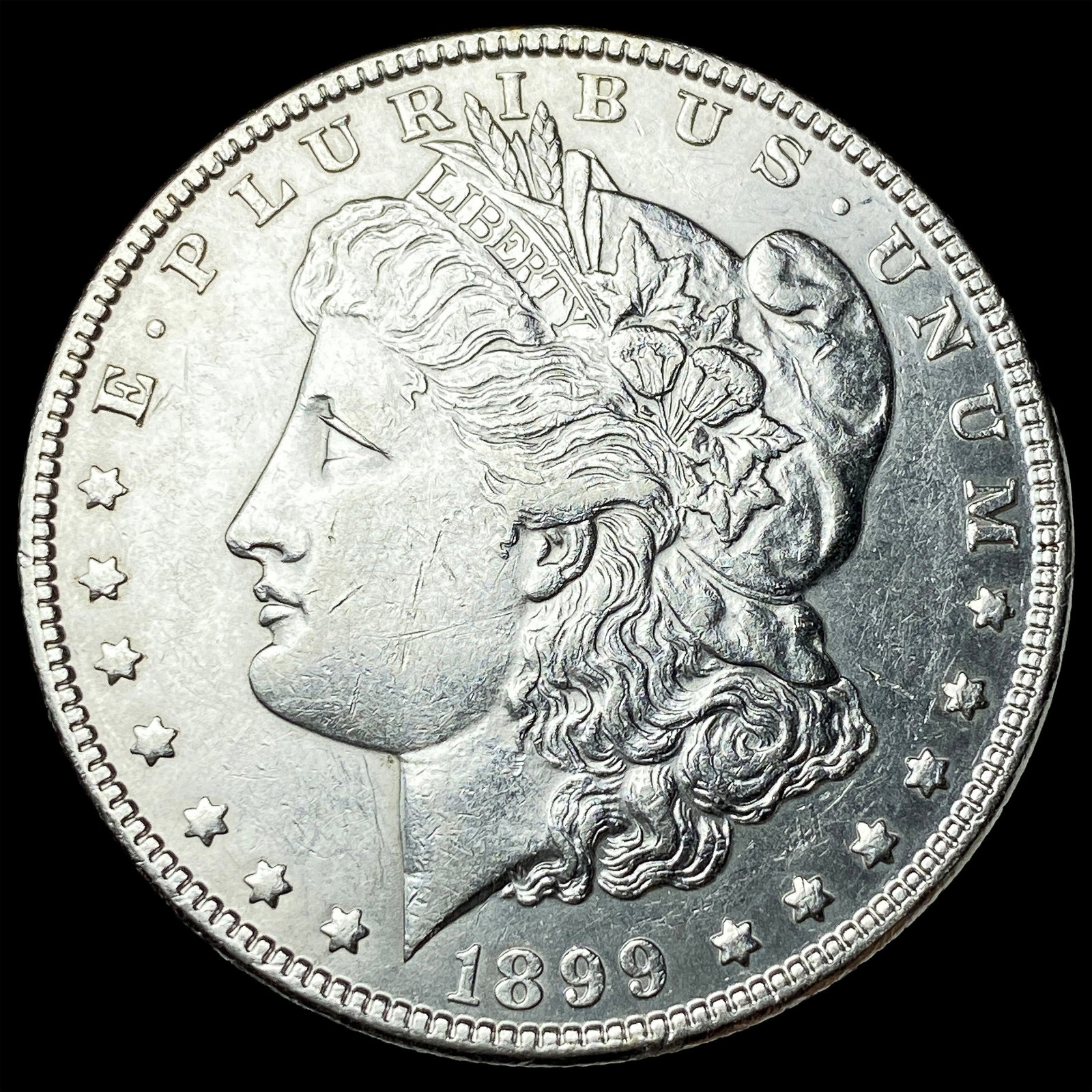 1899 Silver Morgan Dollar CLOSELY UNCIRCULATED: 1899 Silver Morgan Dollar CLOSELY UNCIRCULATED