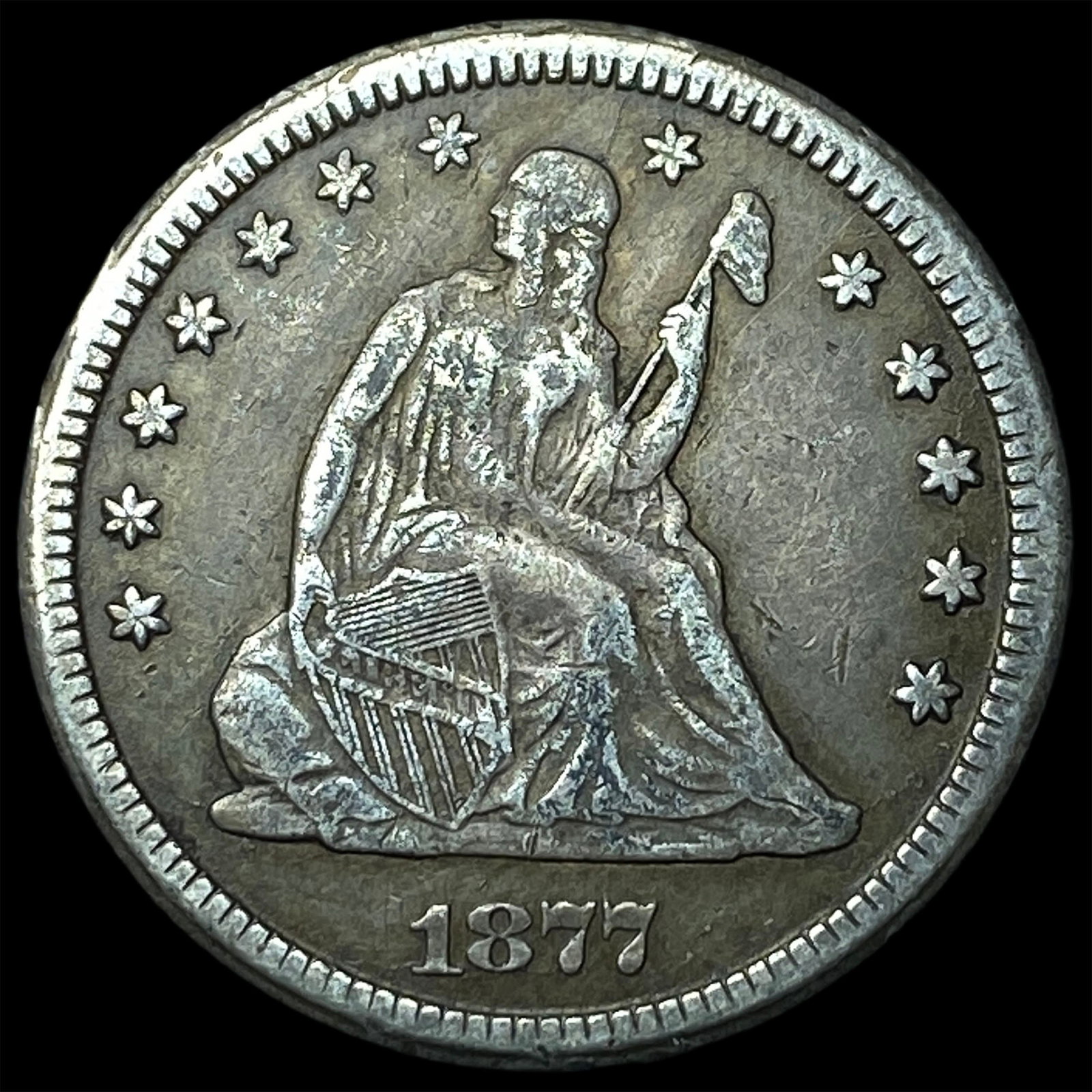 1877-CC Silver Quarter Dollar NEARLY UNCIRCULATED (1 of 2)