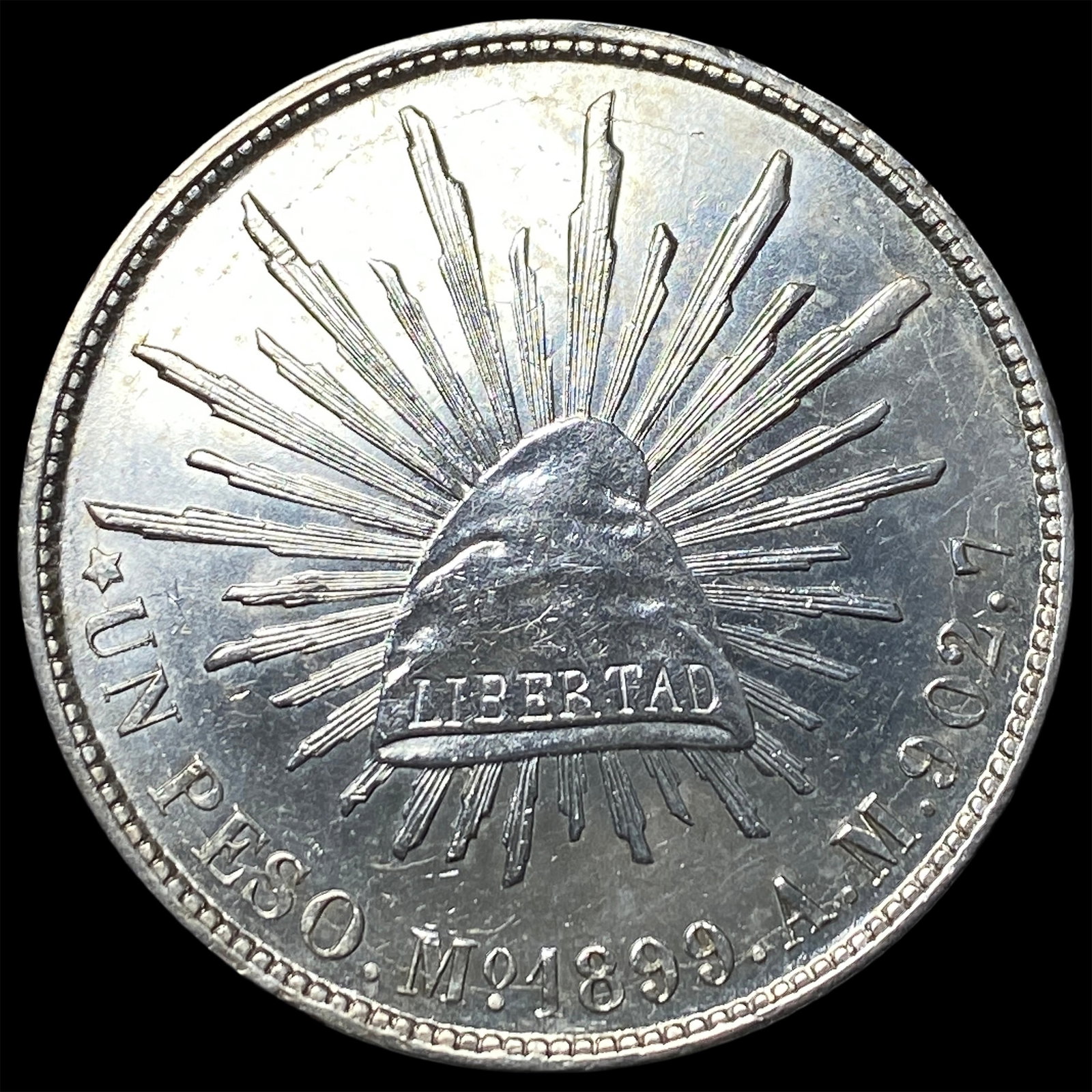 1899-Mo Mexico Silver Peso HIGH GRADE: 1899-Mo Mexico Silver Peso HIGH GRADE