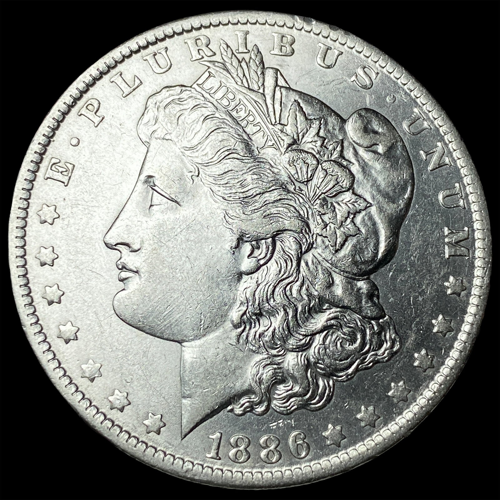 1886-O Silver Morgan Dollar CLOSELY UNCIRCULATED (1 of 2)
