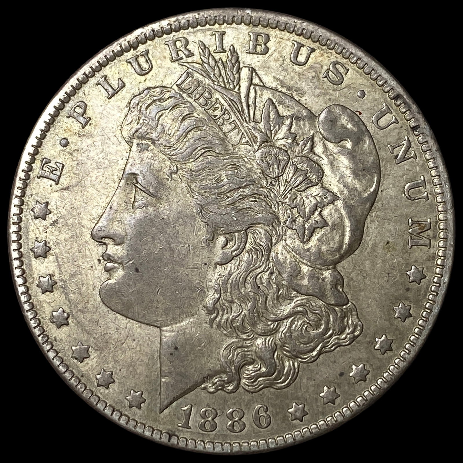 1886-O Silver Morgan Dollar NEARLY UNCIRCULATED (1 of 2)