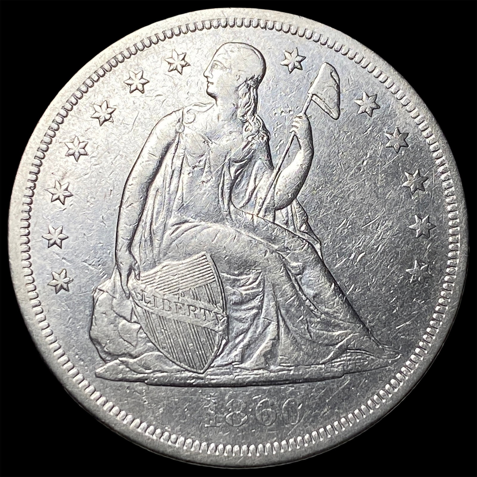 1860-O Silver Seated Liberty Dollar NEARLY UNCIRCULATED (1 of 2)