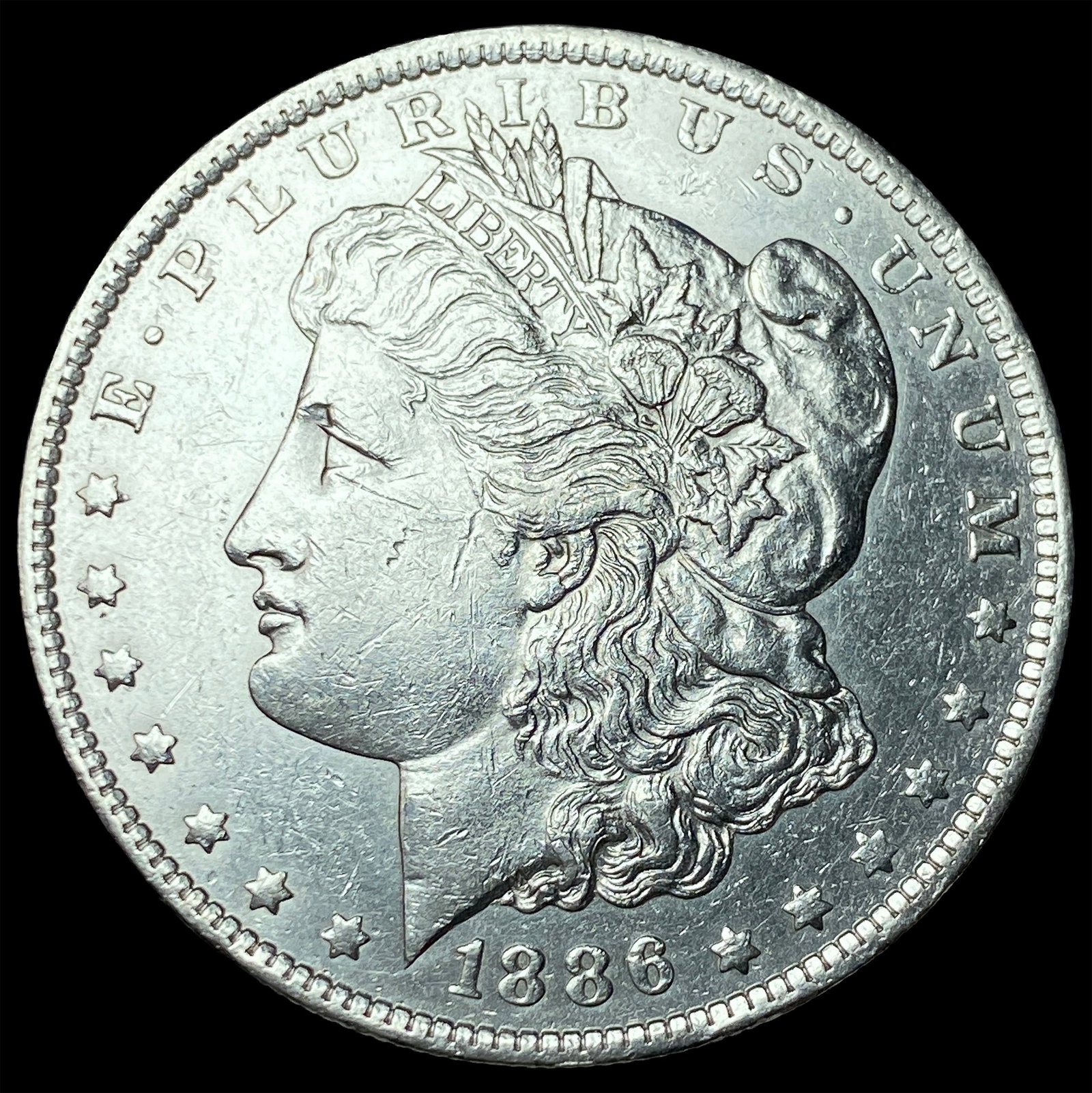 1886 Morgan Silver Dollar CLOSELY UNCIRCULATED (1 of 2)