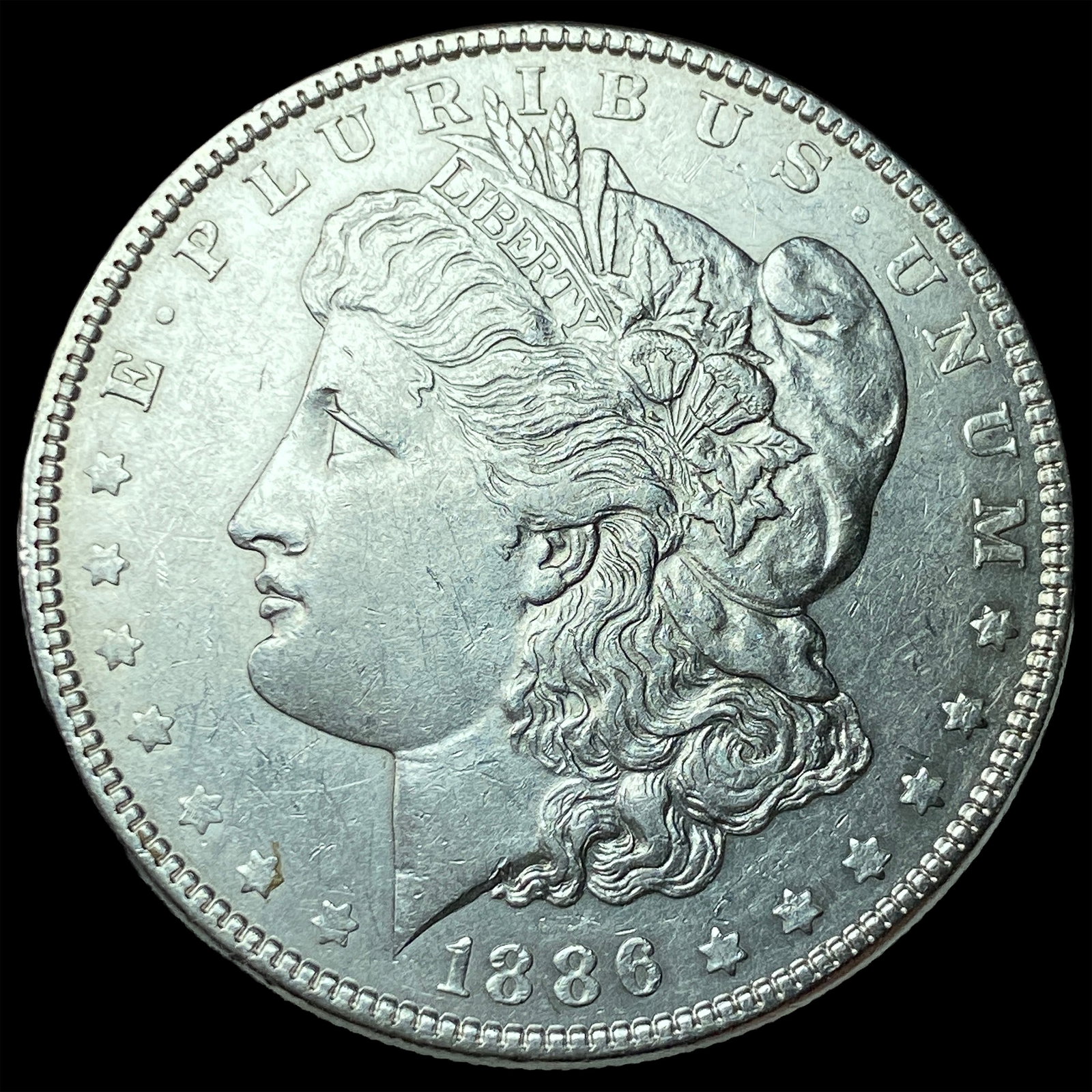 1886 Morgan Silver Dollar CLOSELY UNCIRCULATED (1 of 2)