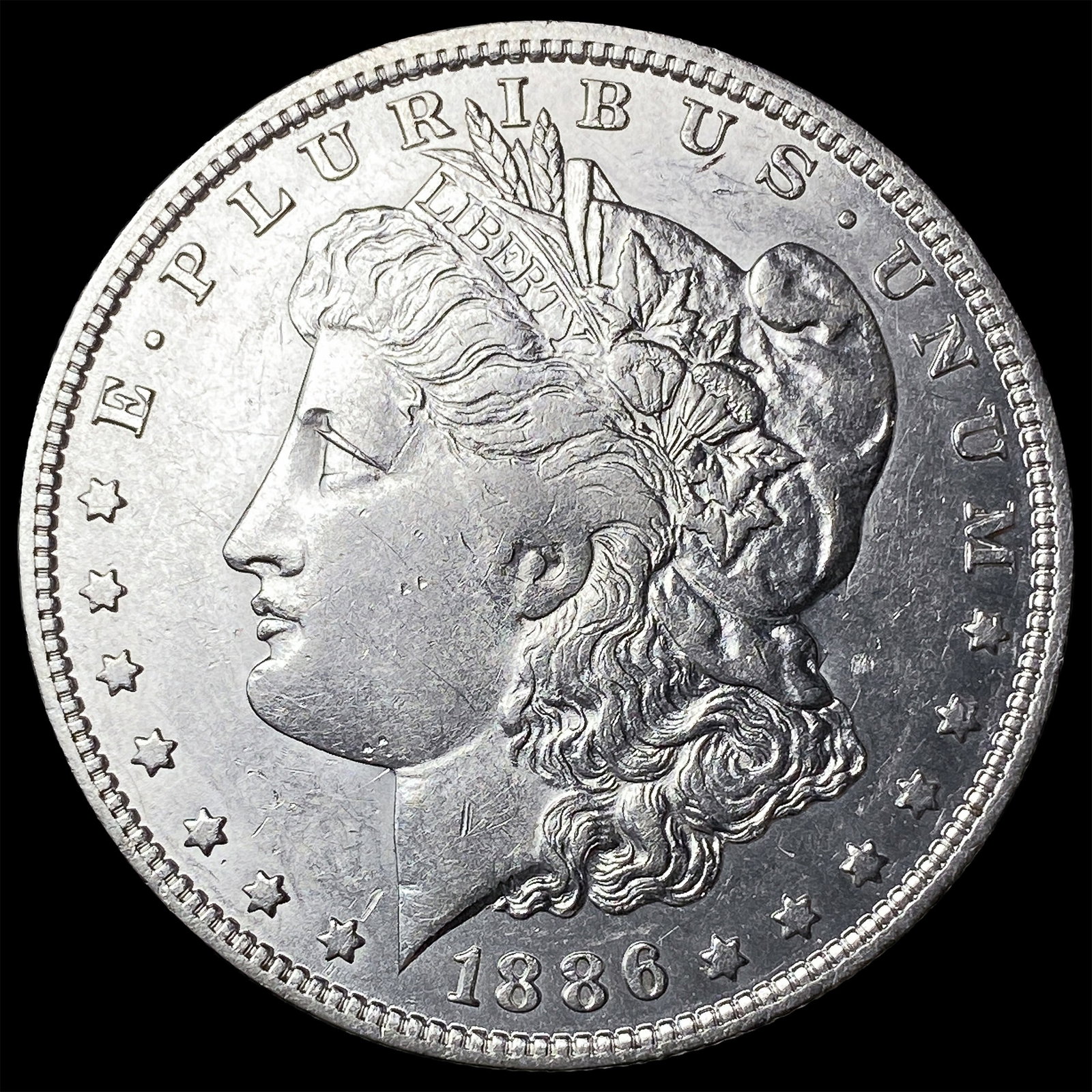 1886-O Morgan Silver Dollar CLOSELY UNCIRCULATED (1 of 2)