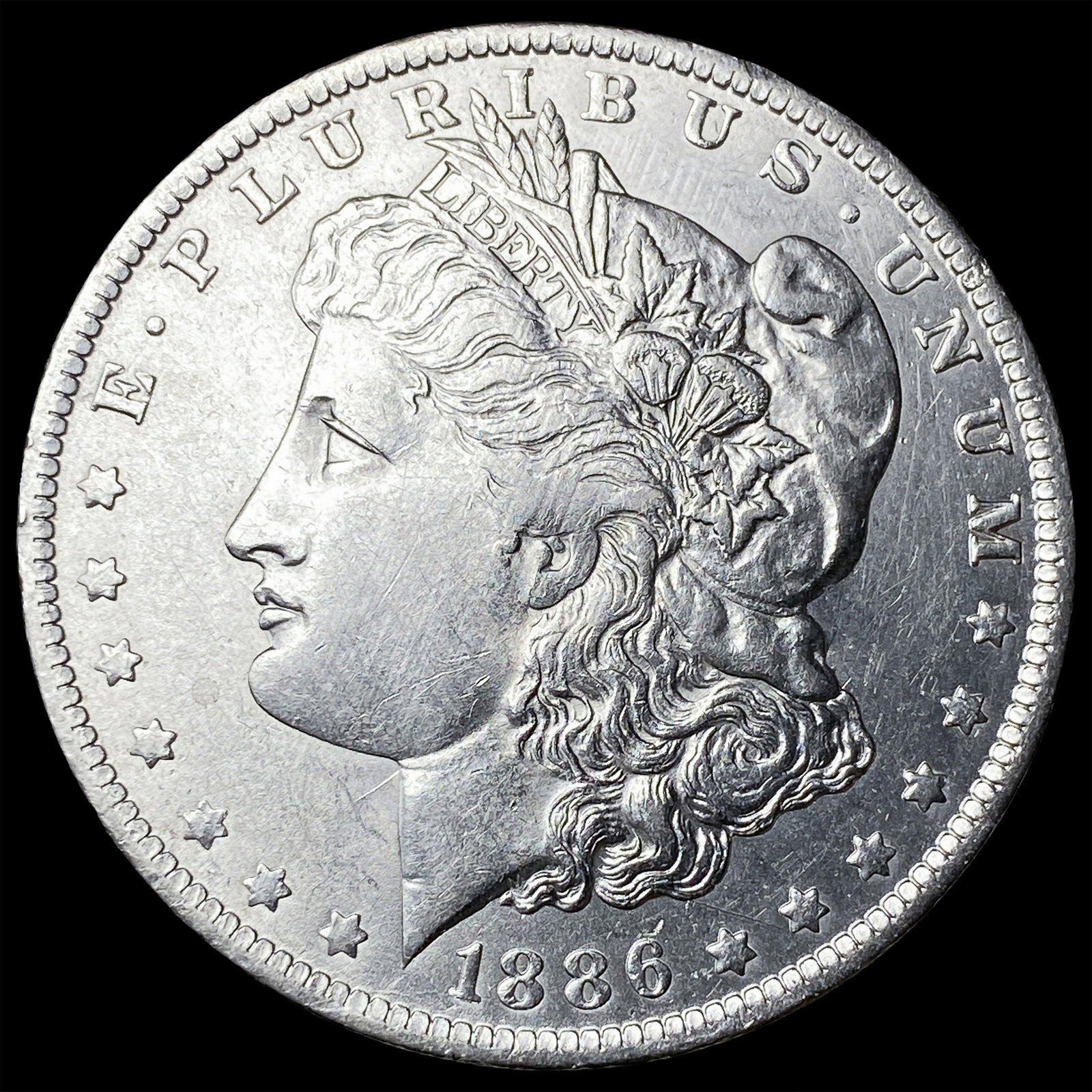 1886-O Silver Morgan Dollar CLOSELY UNCIRCULATED (1 of 2)