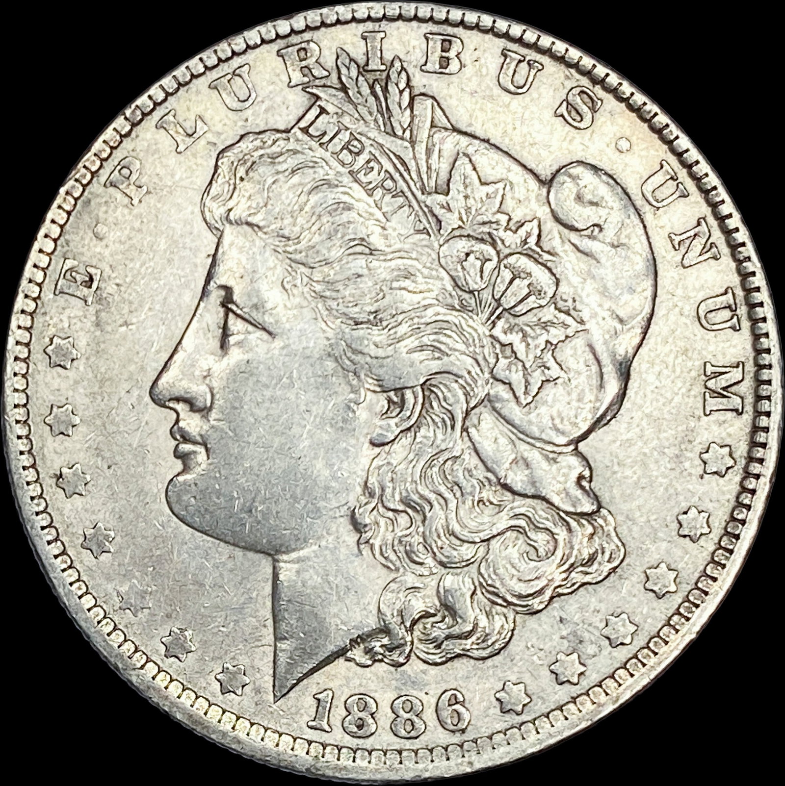 1886-O Silver Morgan Dollar CLOSELY UNCIRCULATED (1 of 2)