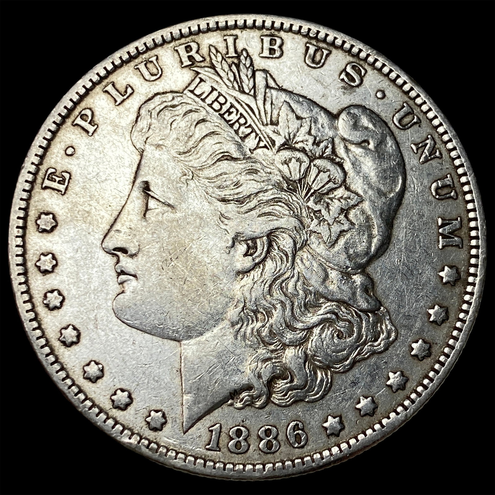 1886-O Silver Morgan Dollar CLOSELY UNCIRCULATED (1 of 2)