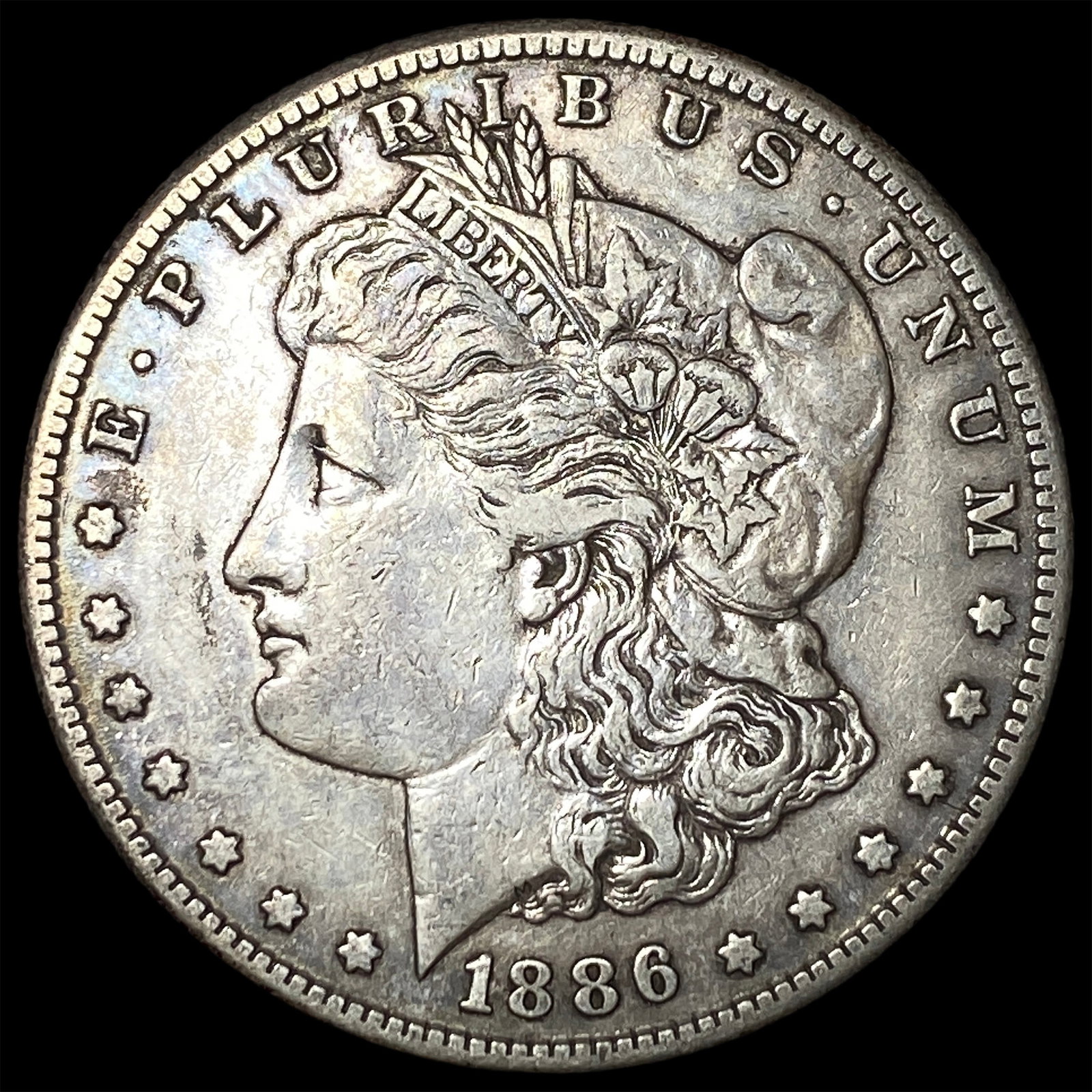 1886-S Silver Morgan Dollar ABOUT UNCIRCULATED: 1886-S Silver Morgan Dollar ABOUT UNCIRCULATED
