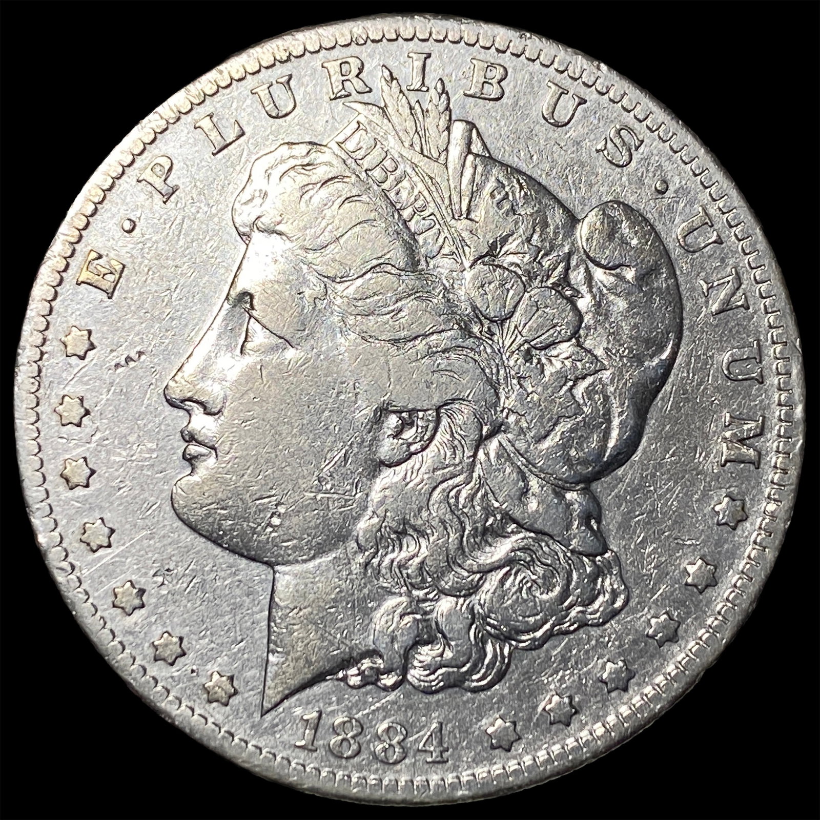 1884-S Silver Morgan Dollar ABOUT UNCIRCULATED: 1884-S Silver Morgan Dollar ABOUT UNCIRCULATED