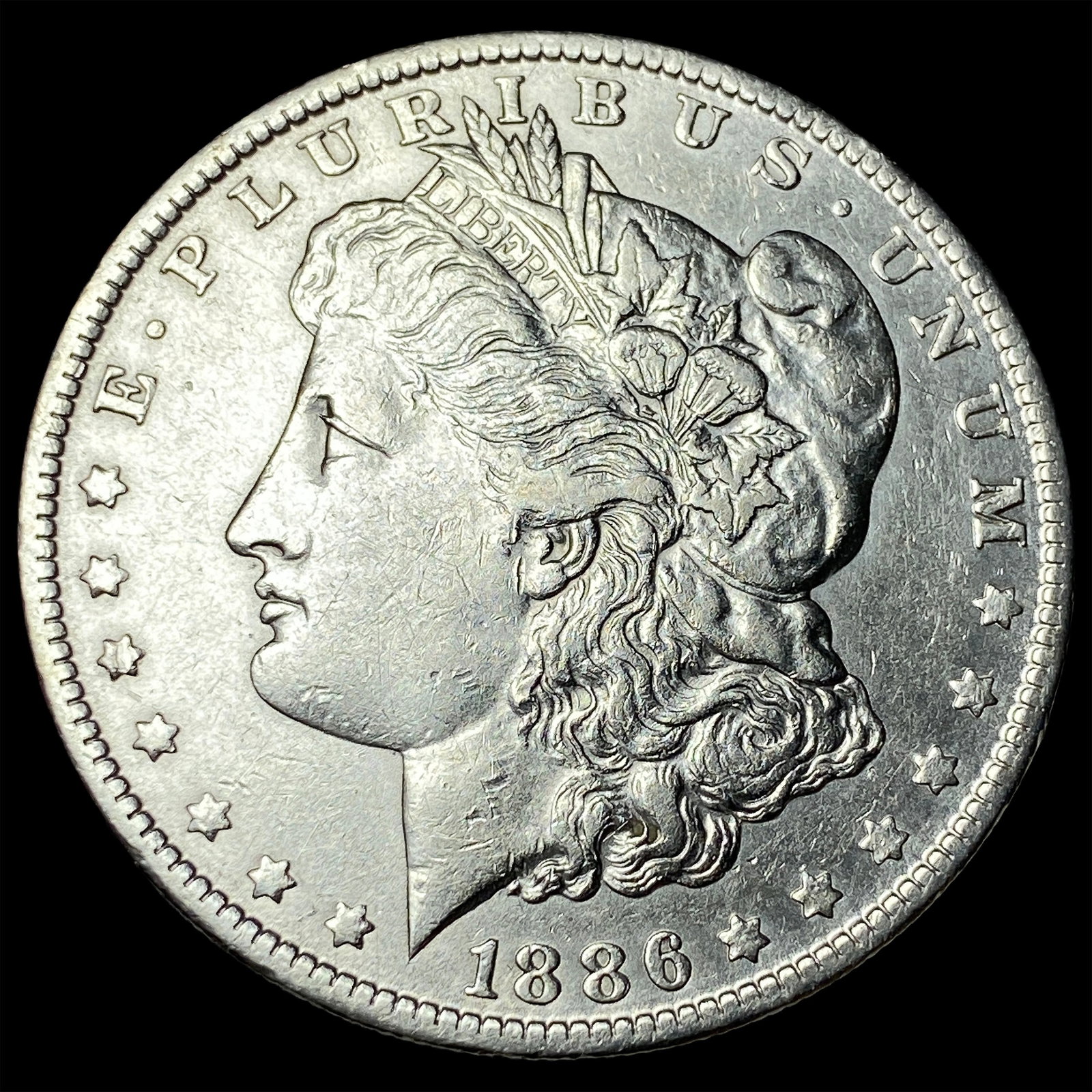 1886-O Silver Morgan Dollar CLOSELY UNCIRCULATED (1 of 2)