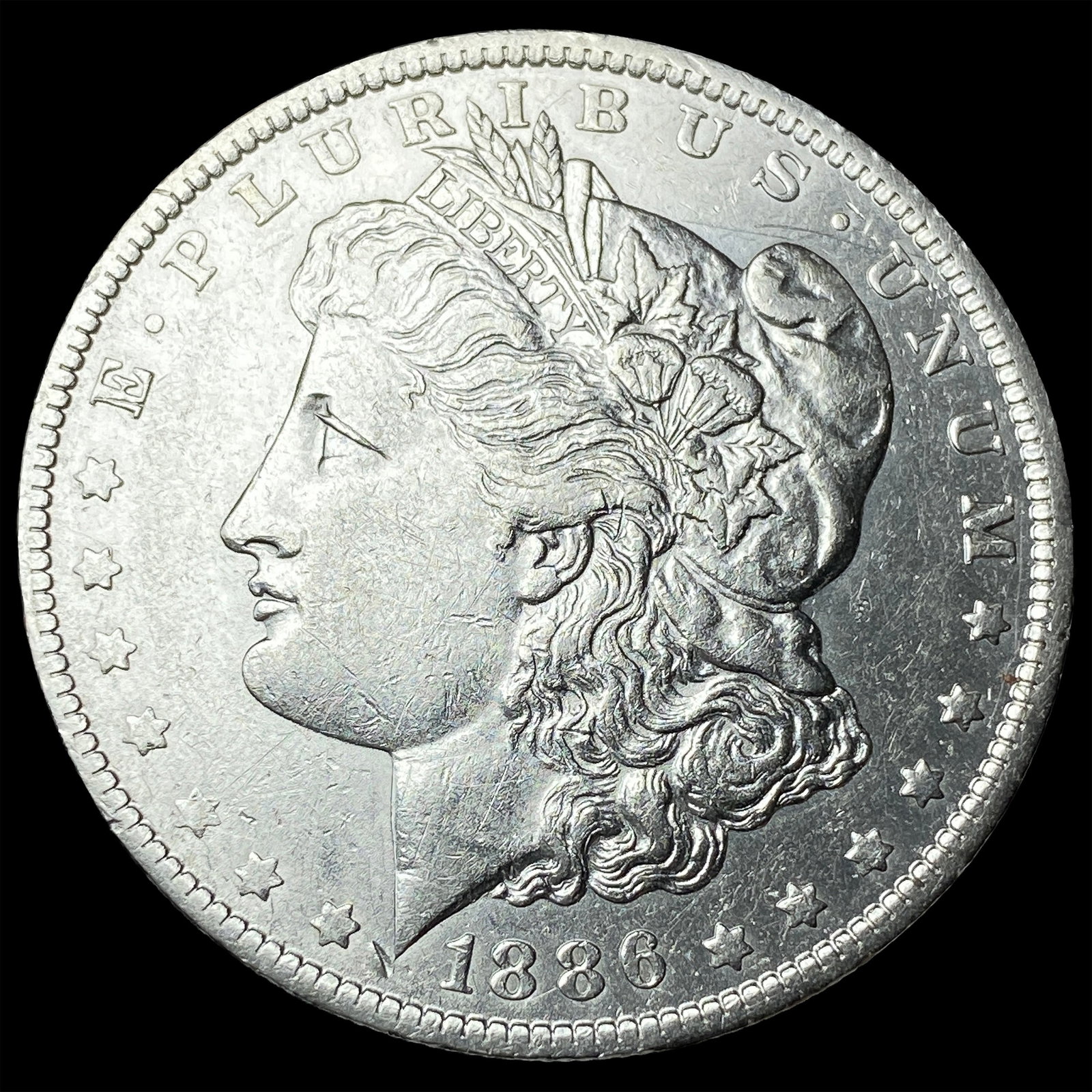 1886-O Silver Morgan Dollar CLOSELY UNCIRCULATED (1 of 2)