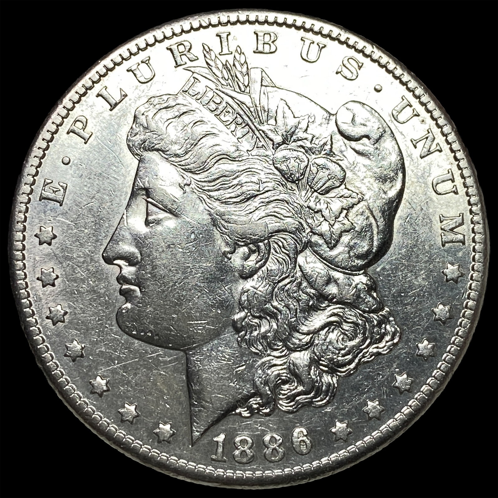 1886 Morgan Silver Dollar CLOSELY UNCIRCULATED (1 of 2)