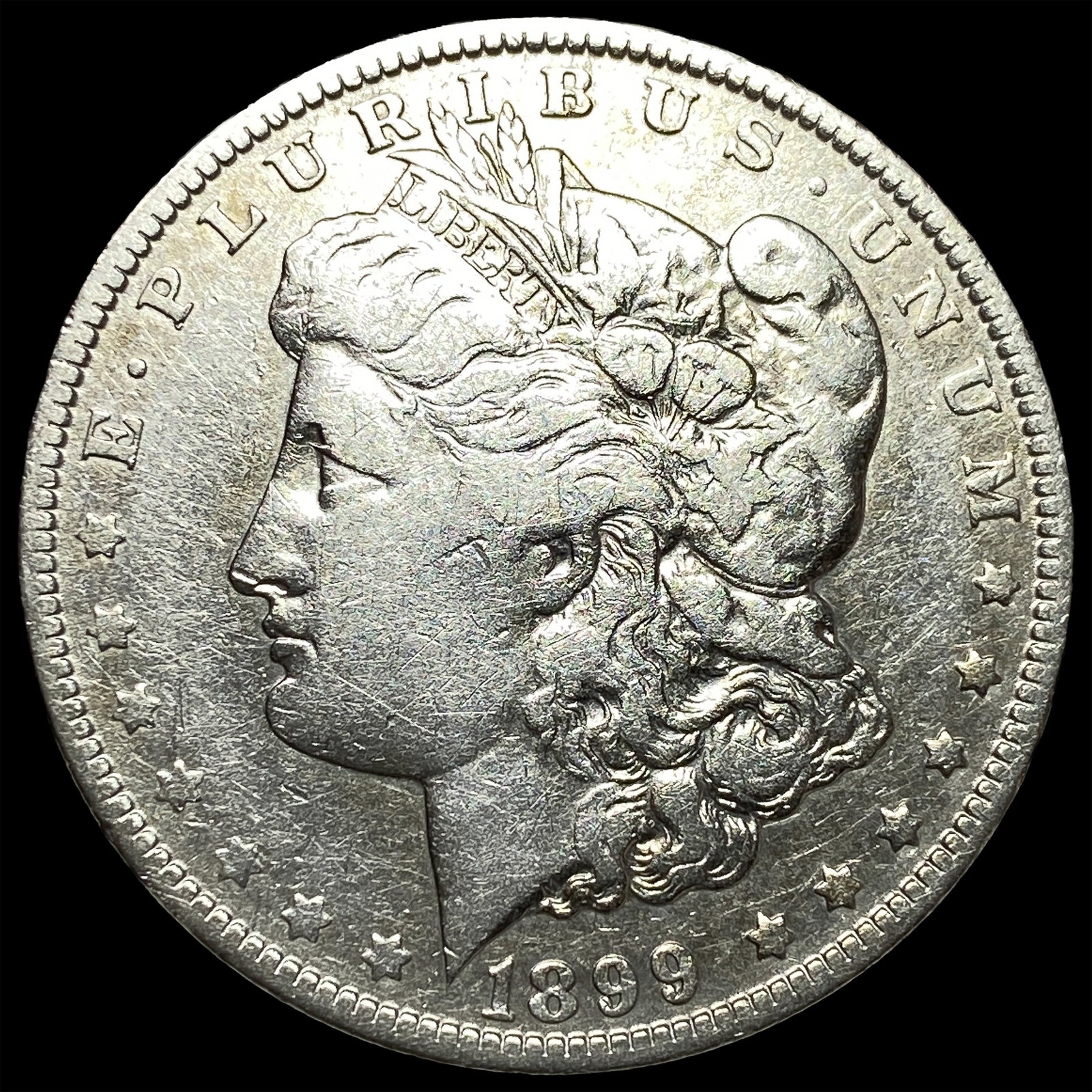 1899-O Micro O Morgan Silver Dollar ABOUT UNCIRCULATED: 1899-O Micro O Morgan Silver Dollar ABOUT UNCIRCULATED
