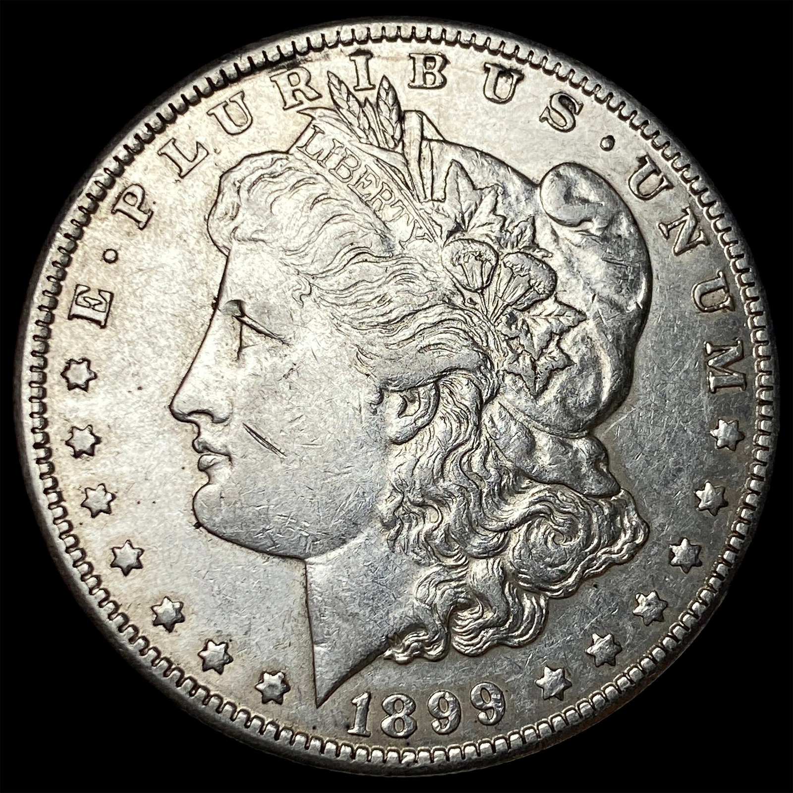 1899-O Morgan Silver Dollar CLOSELY UNCIRCULATED (1 of 2)