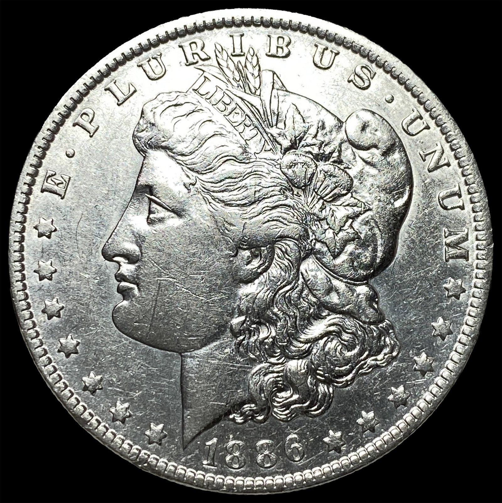 1886-O Silver Morgan Dollar CLOSELY UNCIRCULATED (1 of 2)