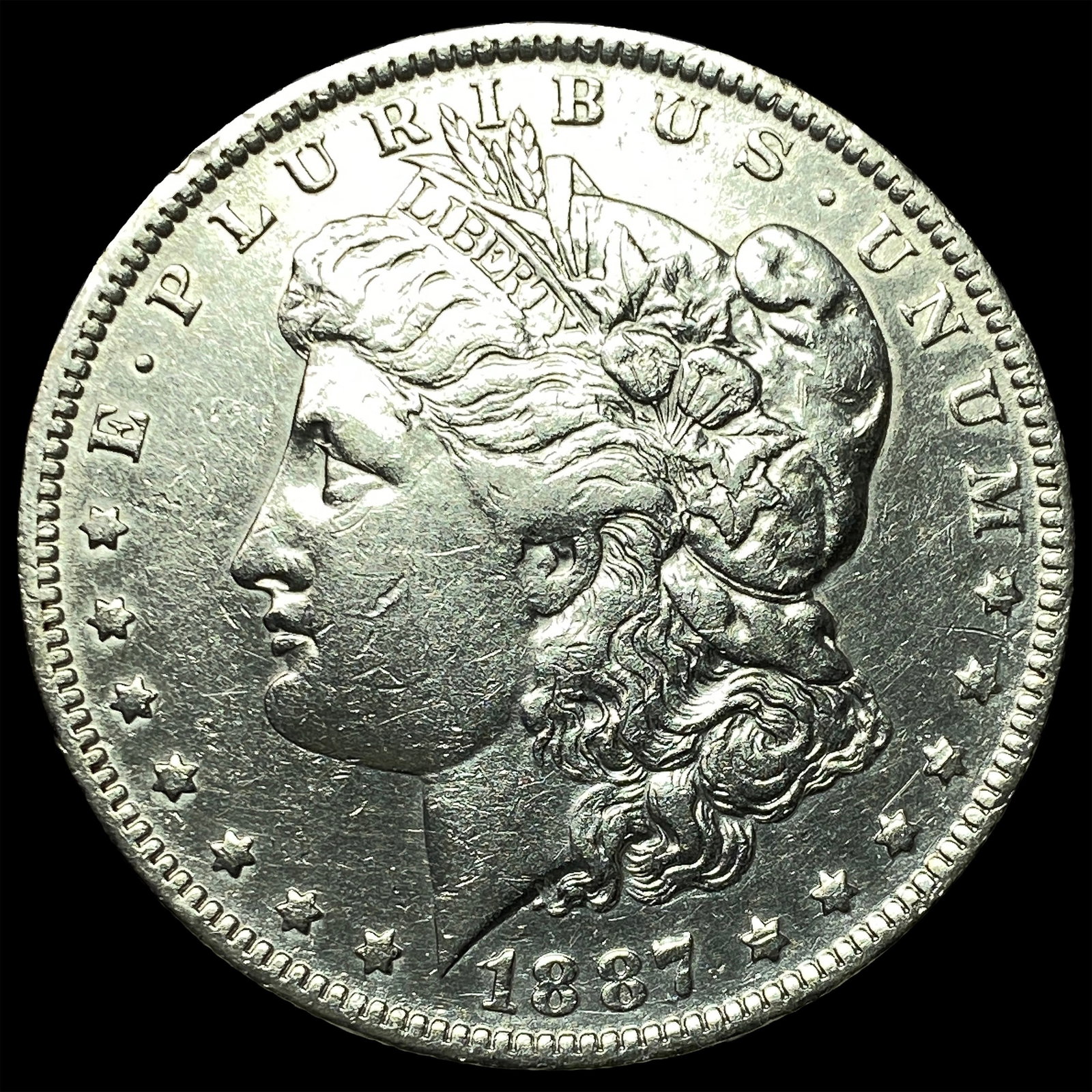 1887-O Silver Morgan Dollar ABOUT UNCIRCULATED: 1887-O Silver Morgan Dollar ABOUT UNCIRCULATED