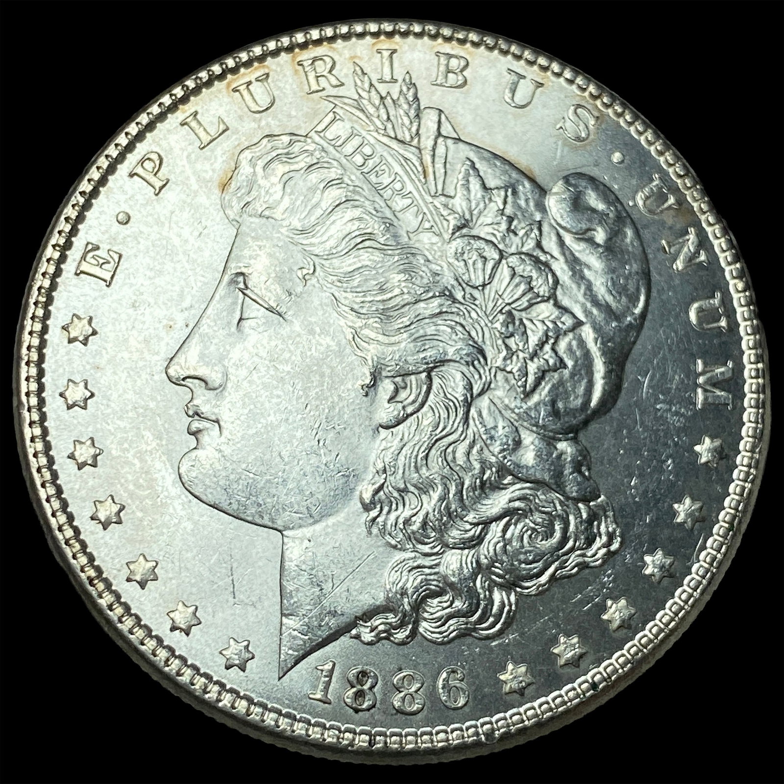 1886 Morgan Silver Dollar CLOSELY UNCIRCULATED (1 of 2)