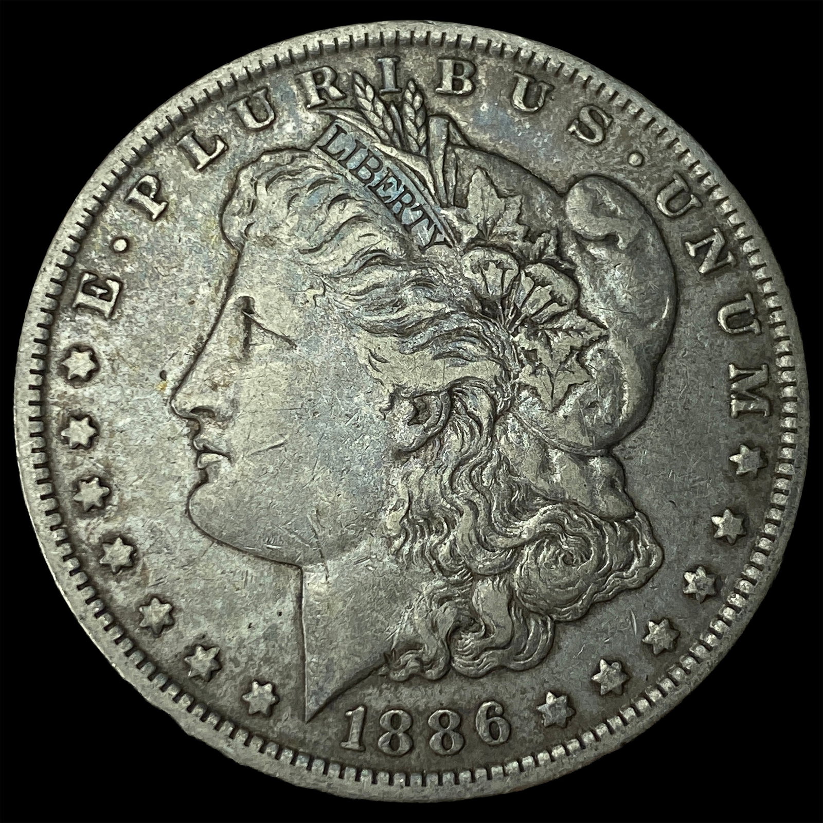 1886 Silver Morgan Dollar NEARLY UNCIRCULATED (1 of 2)