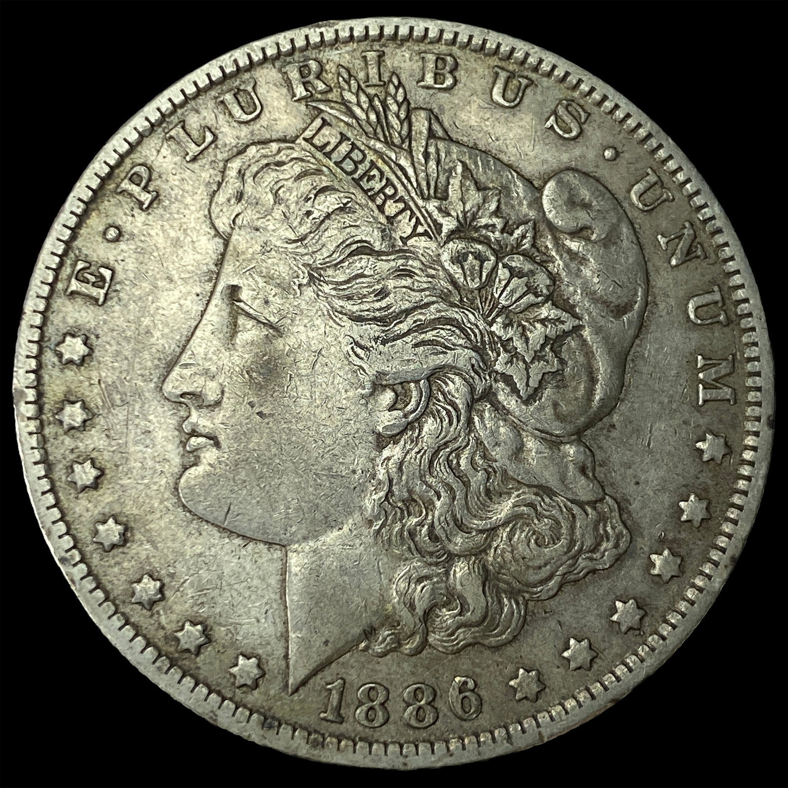 1886-O Silver Morgan Dollar CLOSELY UNCIRCULATED