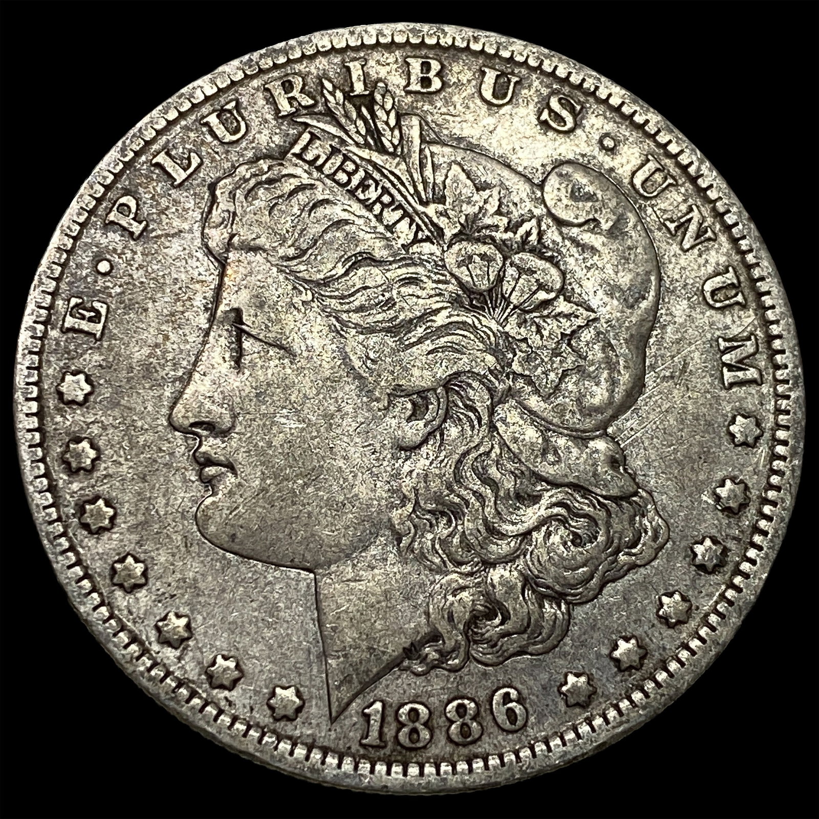 1886-O Silver Morgan Dollar CLOSELY UNCIRCULATED (1 of 2)
