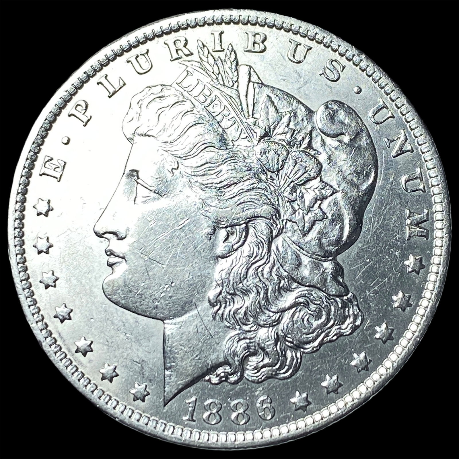 1886-O Silver Morgan Dollar CLOSELY UNCIRCULATED (1 of 2)