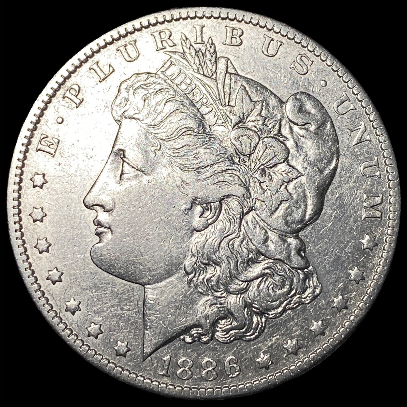 1886-O Morgan Silver Dollar ABOUT UNCIRCULATED: 1886-O Morgan Silver Dollar ABOUT UNCIRCULATED