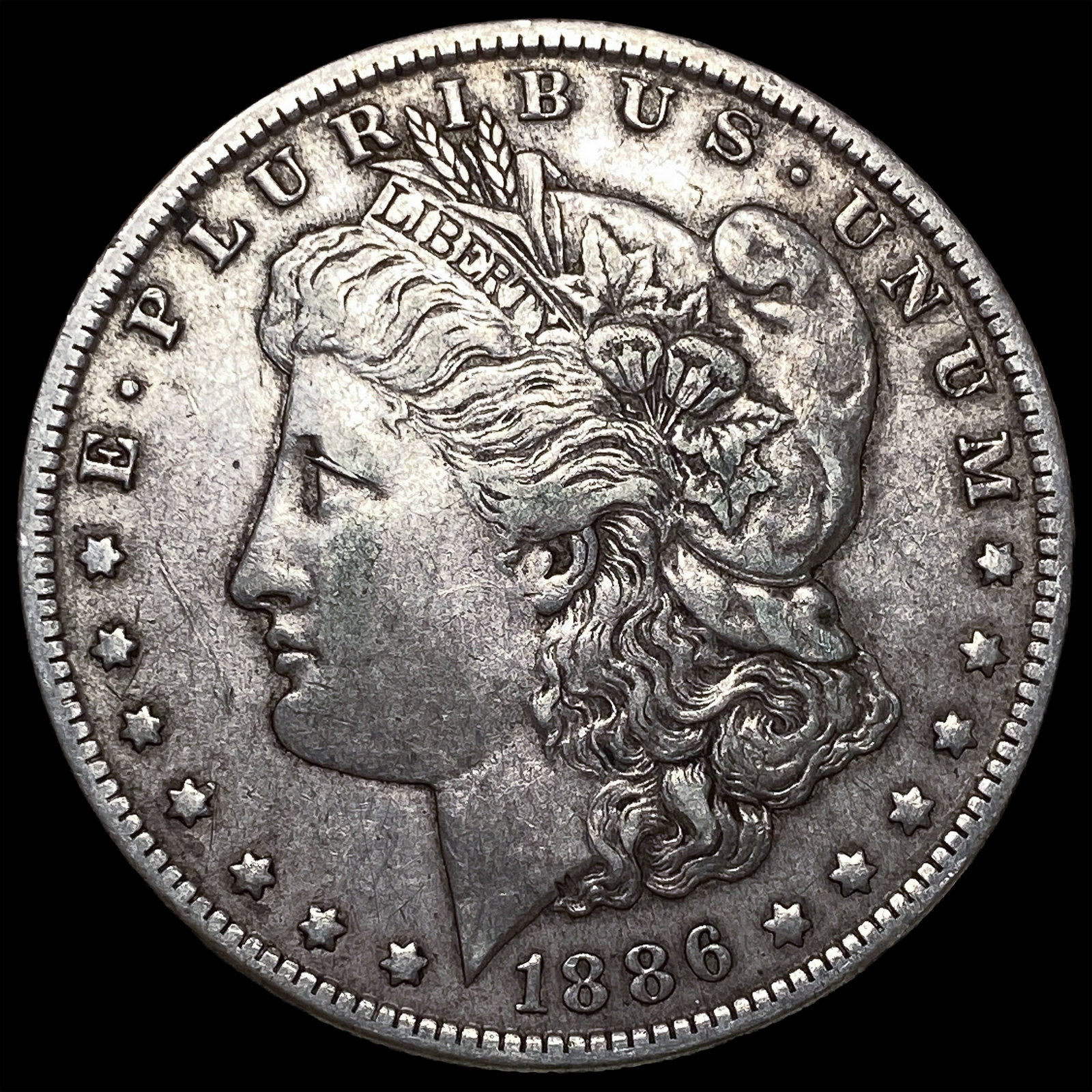 1886-O Silver Morgan Dollar CLOSELY UNCIRCULATED