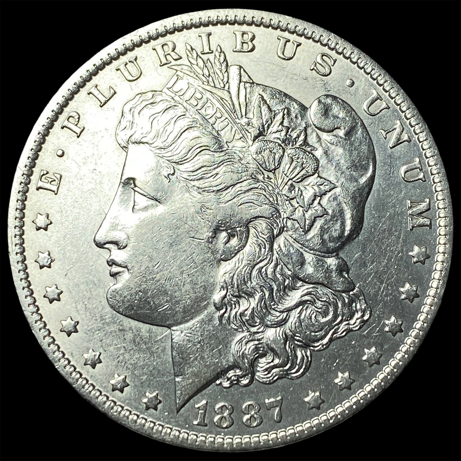 1887-O Silver Morgan Dollar CLOSELY UNCIRCULATED (1 of 2)
