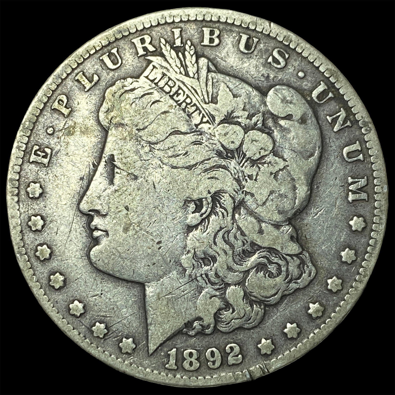 1892-CC Morgan Silver Dollar ABOUT UNCIRCULATED: 1892-CC Morgan Silver Dollar ABOUT UNCIRCULATED