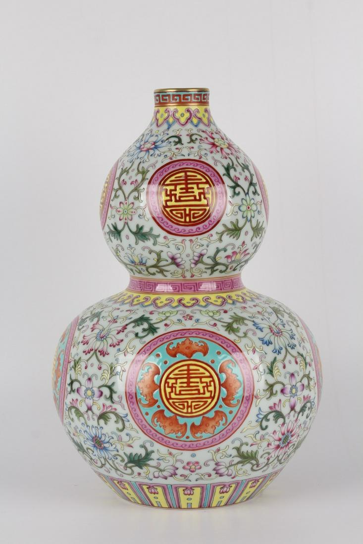 A Porcelain Famille Rose Gourd Vase: Height: 30cm; Mouth-Diameter: 4cm; Belly-Diameter: 20.5cm; Base-Diameter: 10.5cm
