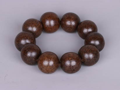 An Agarwood Bracelet: Bead-Diameter: 2.53cm; Weight: 89g