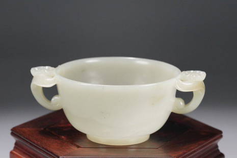 A Hetian Jade Cup: Ear-Distance: 11.6cm.; Width: 8.4cm.; Height: 4.6cm.; Weight: 106.1g