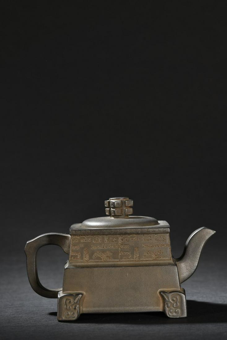 A Zisha Teapot: Height: 9.6cm; Ear-Distance: 16.2cm