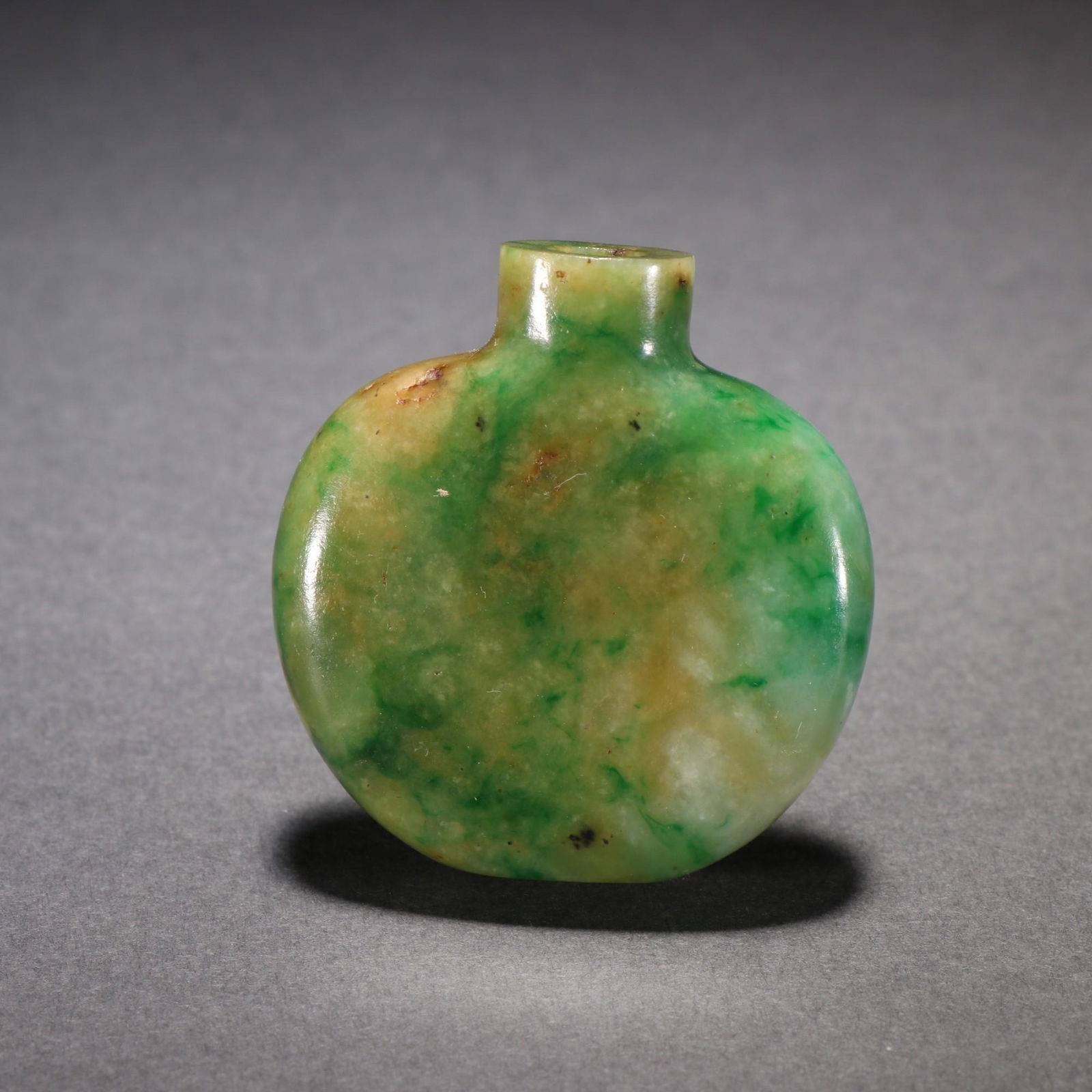 A Jadeite Snuff Bottle: Height: 4cm; Width: 3.9cm; Thickness: 1.2cm; Weight: 31g