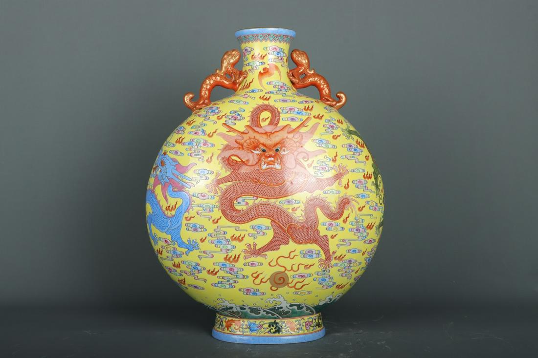 A Porcelain Yellow Glaze Moon Flask Vase: Height: 44.5cm; Mouth-Diameter: 9cm; Belly-Diameter: 35cm.; Base-Diameter: 17cm