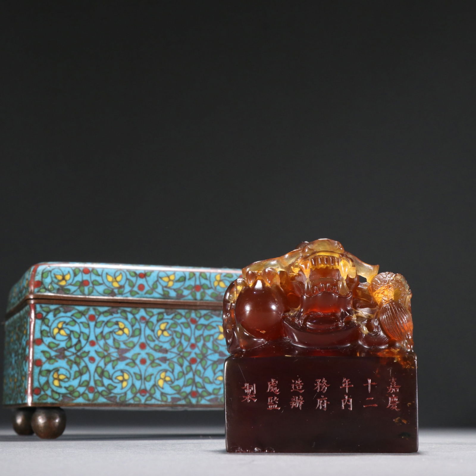 An Amber Seal: Height: 6.4cm; Width: 5.8cm; Thickness: 3.6cm; Weight: 102g