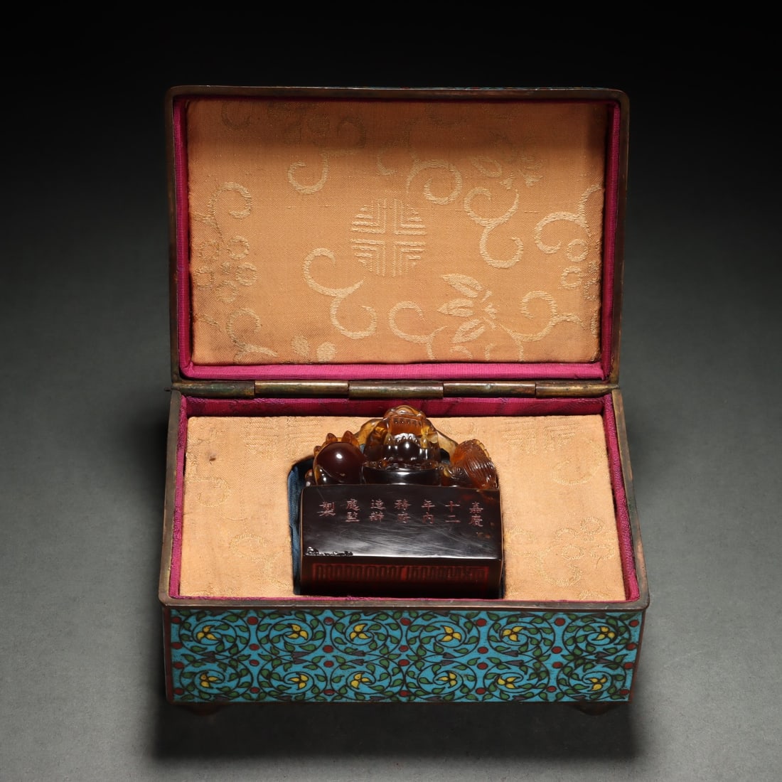 An Amber Seal: Height: 6.4cm; Width: 5.8cm; Thickness: 3.6cm; Weight: 103g