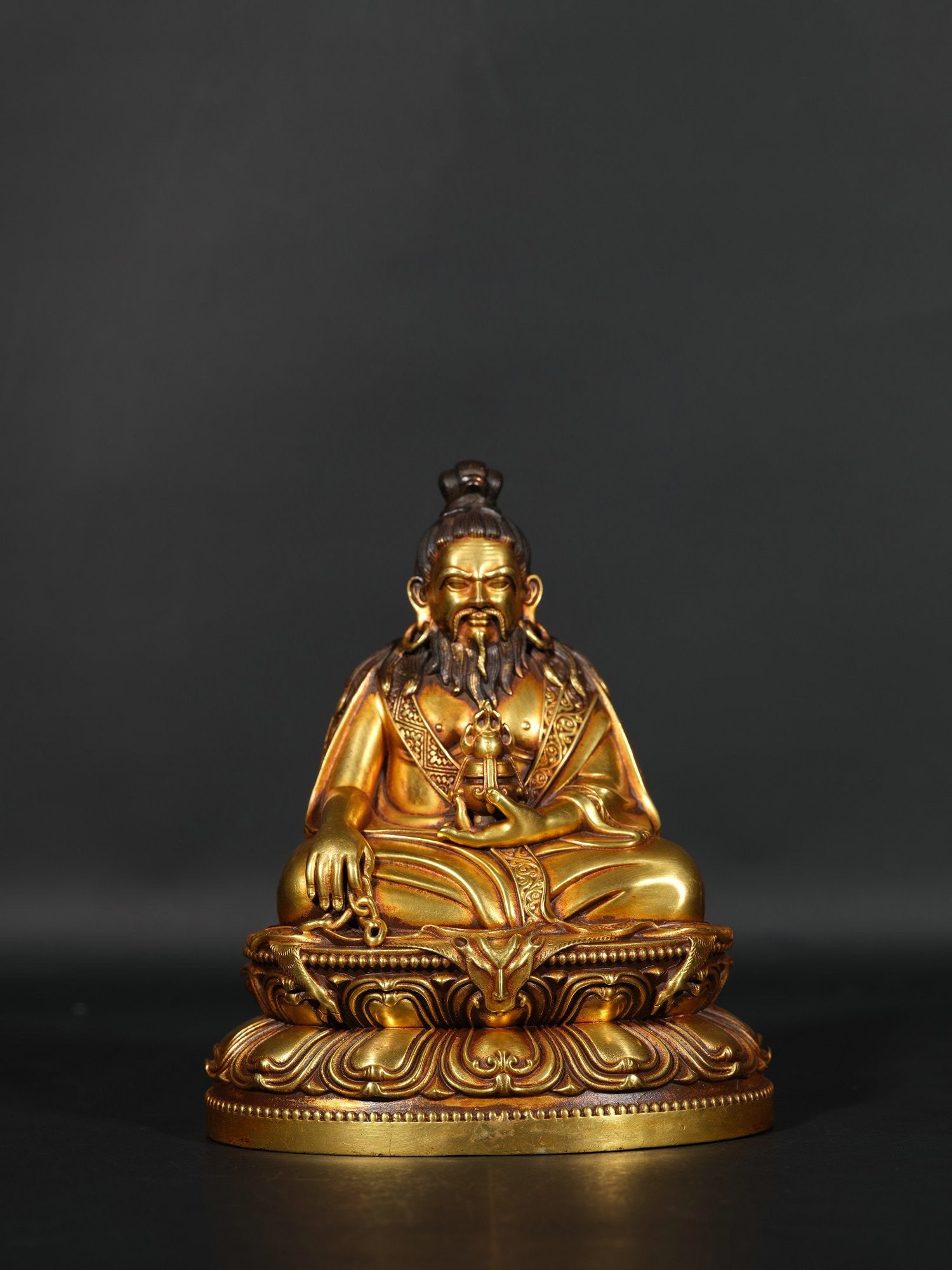 A Gilded copper statue of the Guru Buddha: Height 14.5cm Width 13cm